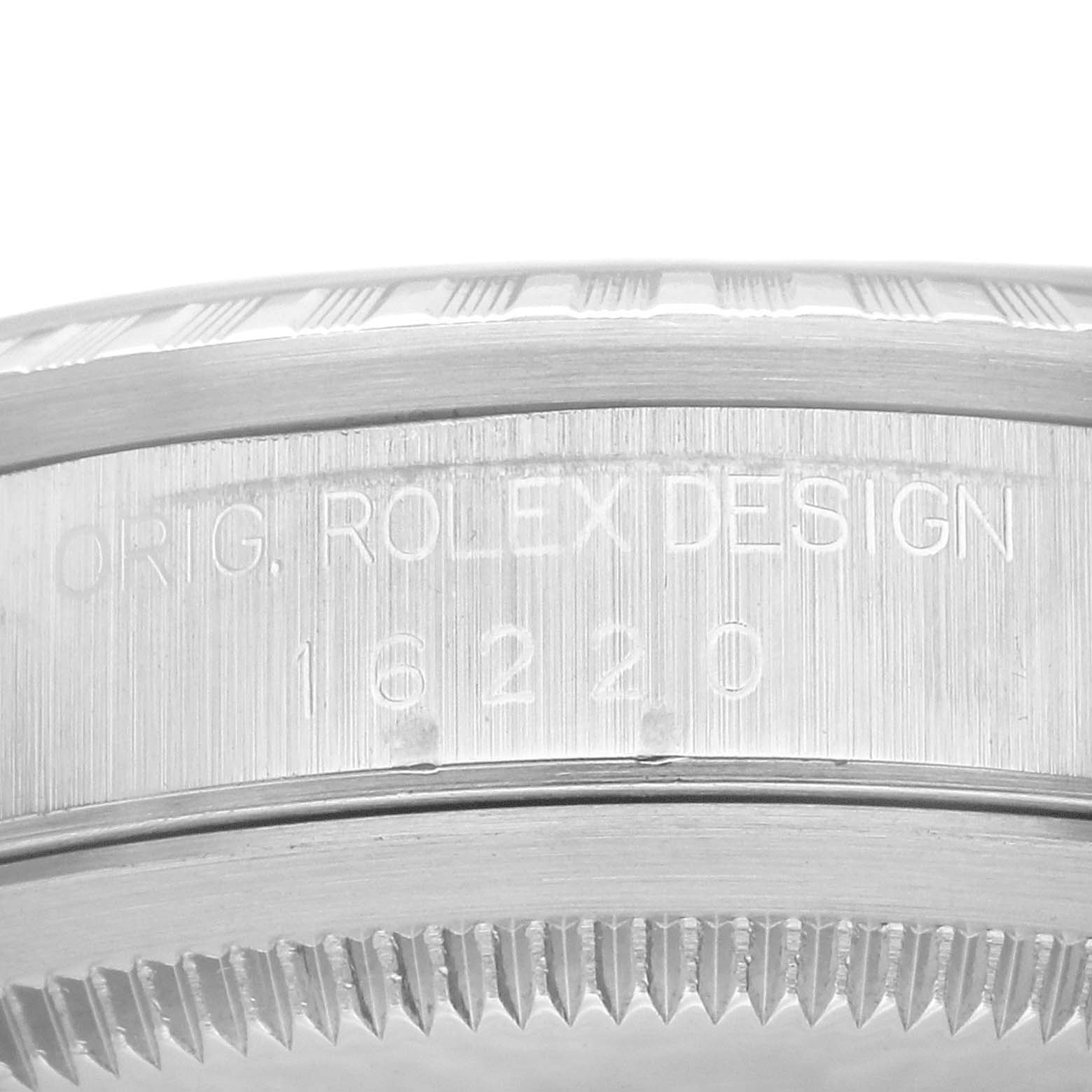 This image shows a close-up of the case side and bezel of a Rolex Datejust 16220 Men's Stainless Steel Black Dial 16220 Men's Stainless Steel Black Dial model, displaying the model number 16220.