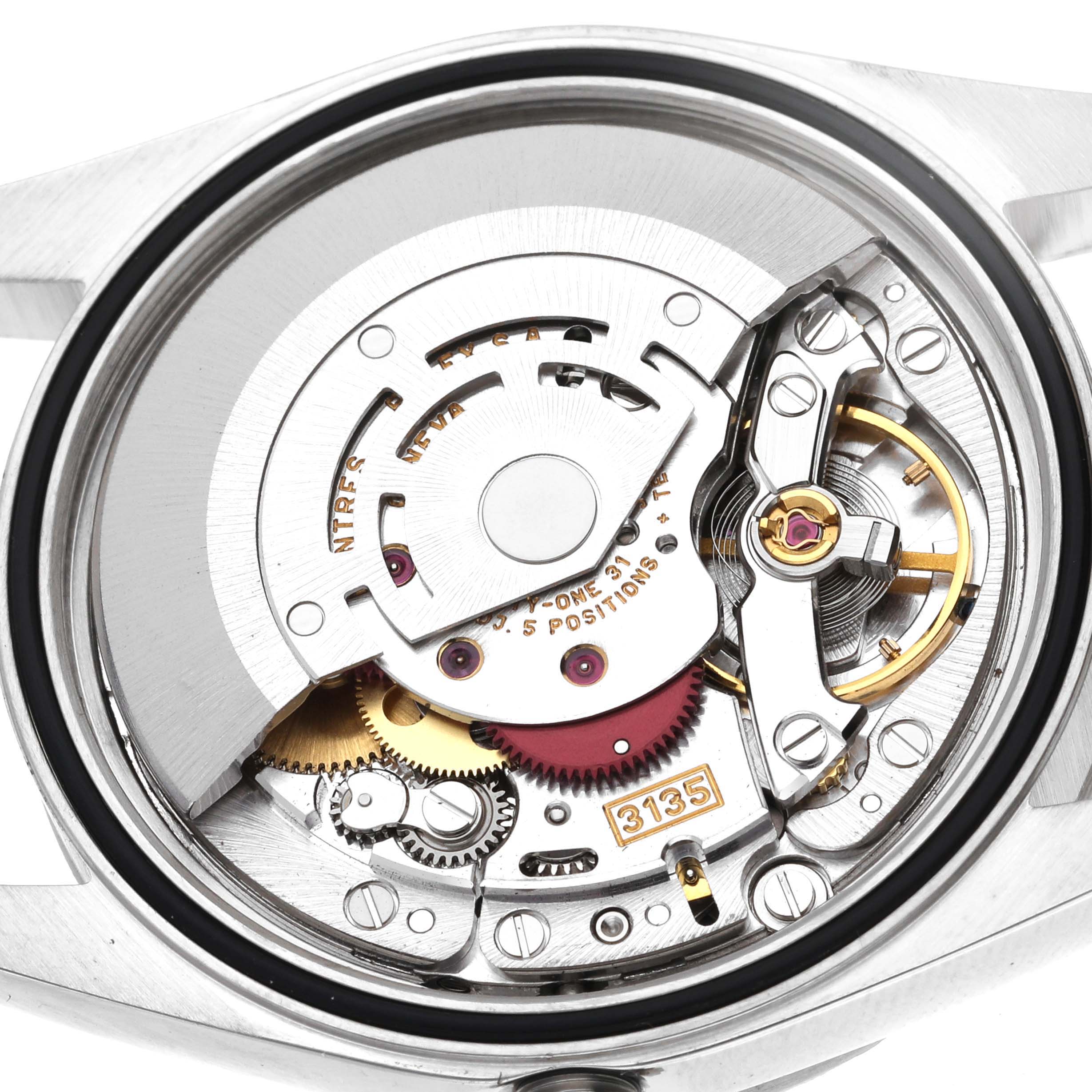 This image shows the inner mechanical movement of the Rolex Datejust 16220 Men's Stainless Steel Black Dial 16220 Men's Stainless Steel Black Dial watch from a rear angle, focusing on the intricate gears and components.