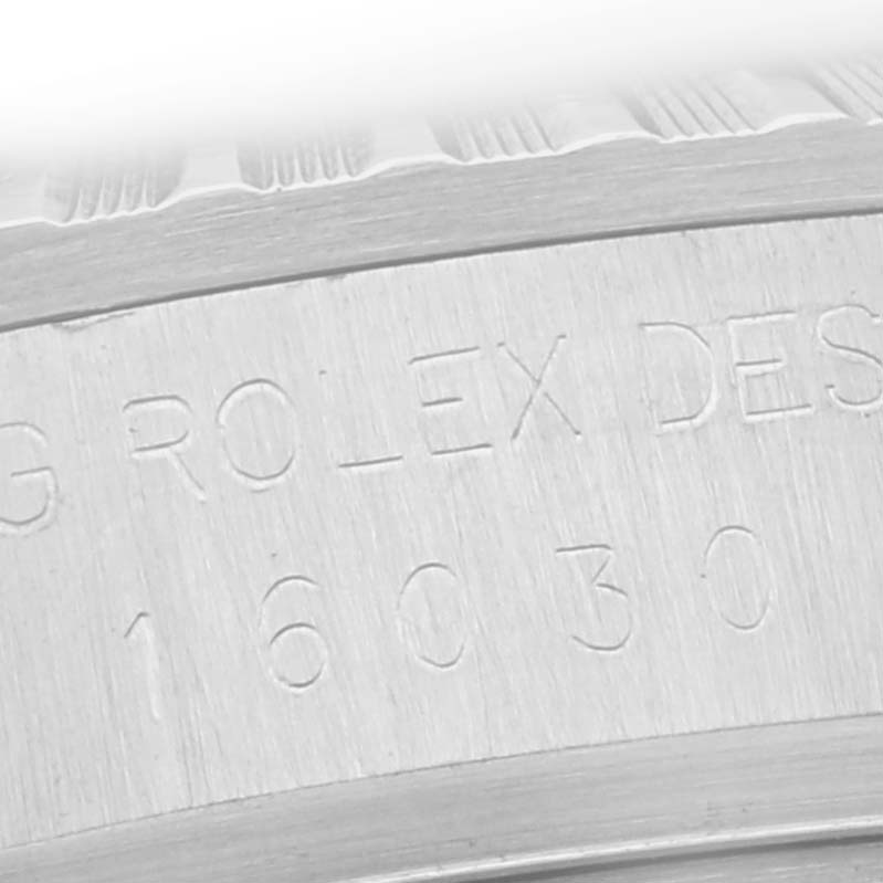The image shows the side of the bezel and engraved serial numbers of a Rolex Datejust 16030 Men
s Stainless Steel Silver Dial 16030 Men
s Stainless Steel Silver Dial watch.