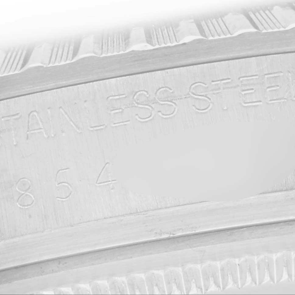 The image shows a close-up of the engraving on the bezel or case rim of a Rolex Datejust 16030 Men
s Stainless Steel Silver Dial 16030 Men
s Stainless Steel Silver Dial watch, highlighting the text "STAINLESS STEEL."