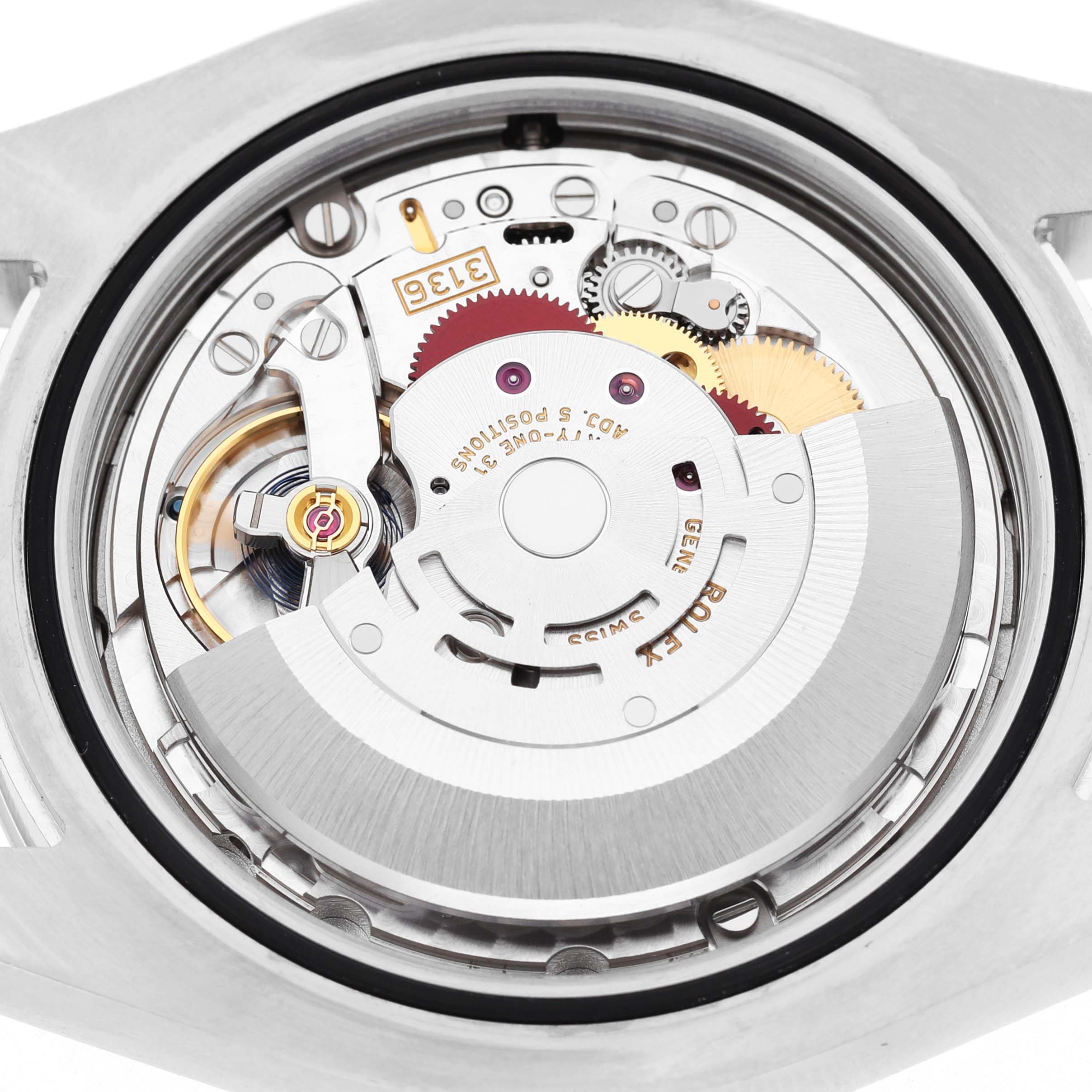 This image shows a close-up of the movement inside the Rolex Datejust 41 116300 Men's Stainless Steel Blue Dial watch, highlighting its internal gears and components.