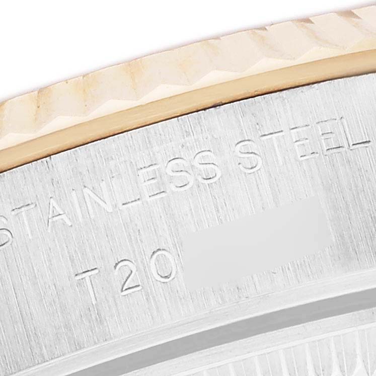 The image shows a close-up of the Rolex Datejust 69173 Women
s Steel and Gold (two tone) Mother of Pearl Dial 69173 Women
s Steel and Gold (two tone) Mother of Pearl Dial watch
s stainless steel case back, highlighting engravings and part of the bezel.