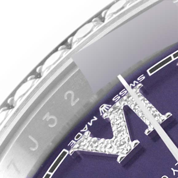 The image shows a close-up of the Datejust model by Rolex, focusing on the bezel, part of the dial, and the Swiss Made marking.