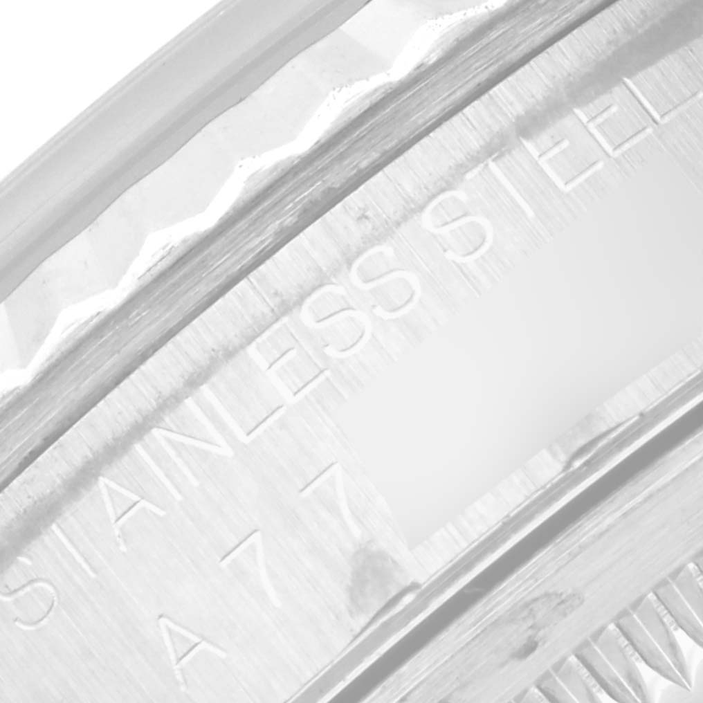 The image shows a close-up view of the side engraving on the stainless steel case back of a Rolex Datejust 16234 Men's Stainless Steel Silver Dial 16234 Men's Stainless Steel Silver Dial watch.