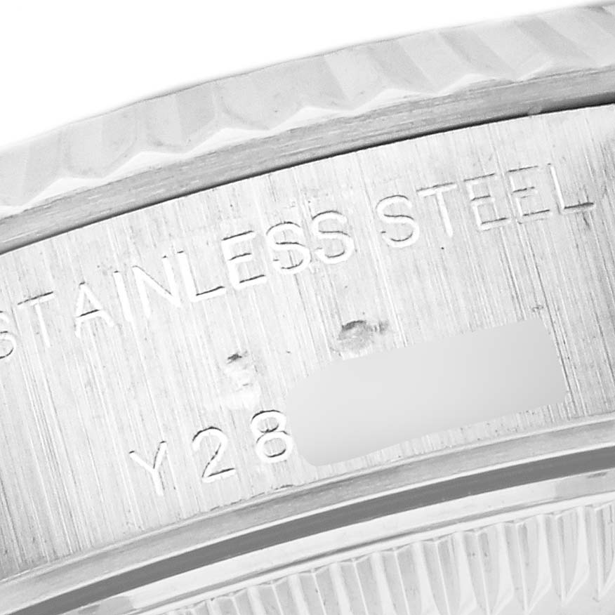 The image shows the side engraving on the stainless steel case of a Rolex Datejust 79174 Women's Stainless Steel Mother of Pearl Dial 79174 Women's Stainless Steel Mother of Pearl Dial watch.