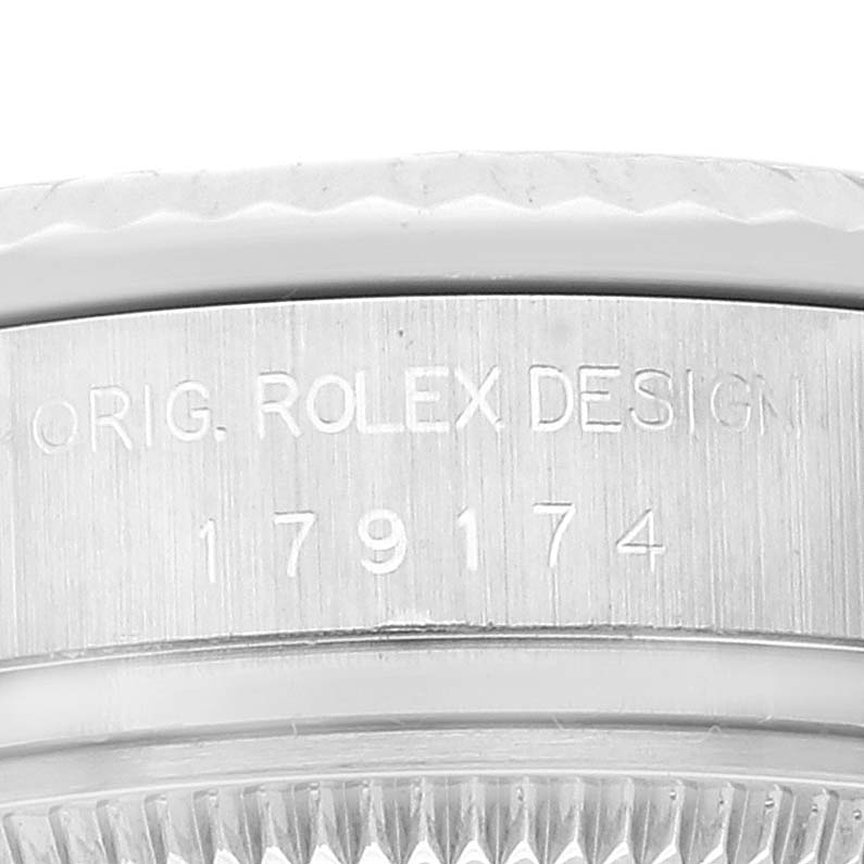 The image shows a close-up of the case side of a Rolex Datejust 179174 Women
s Stainless Steel Mother of Pearl Dial 179174 Women
s Stainless Steel Mother of Pearl Dial watch, featuring the engraved model number.