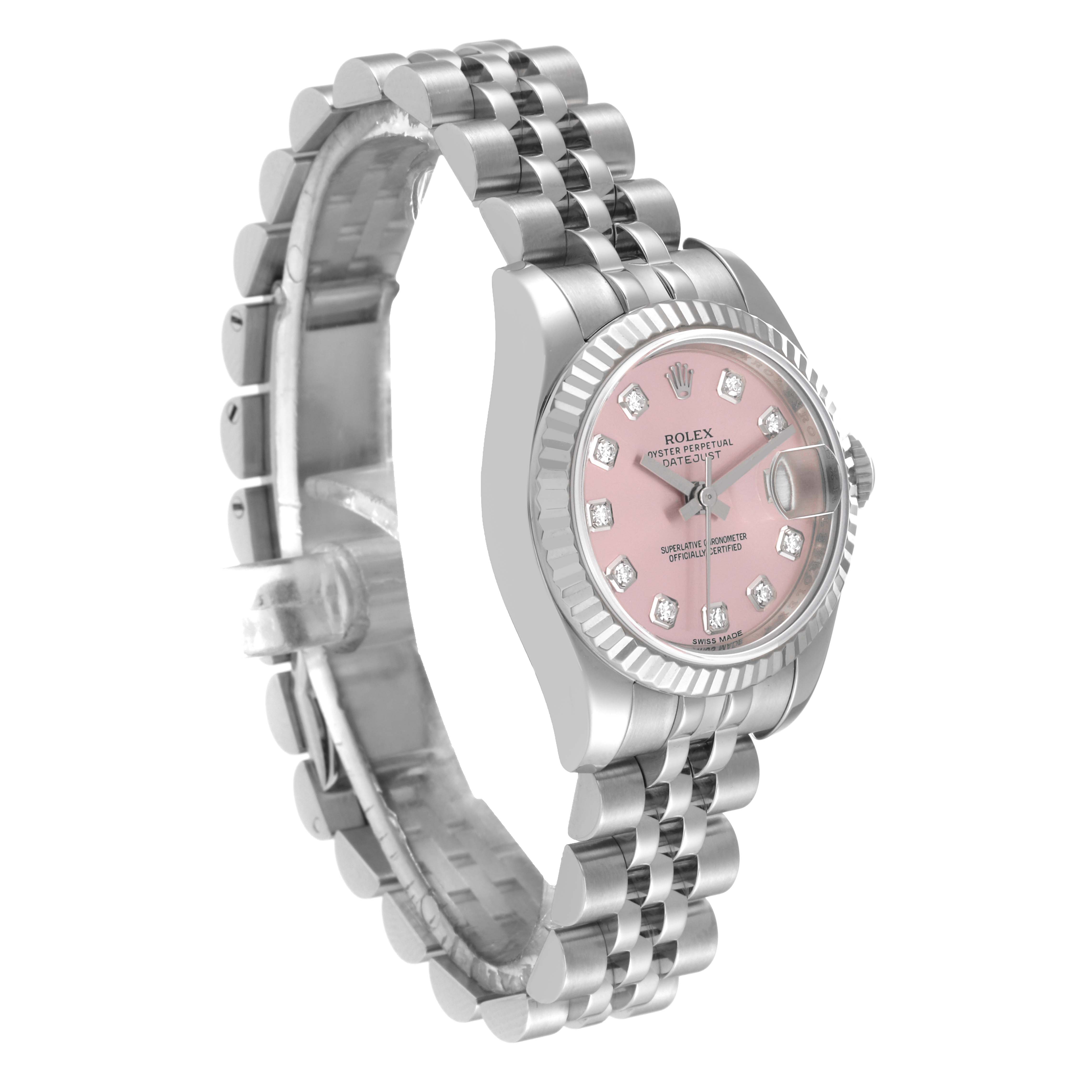 The image showcases a Rolex Datejust 179174 Women's Stainless Steel Pink Dial 179174 Women's Stainless Steel Pink Dial watch from a side angle, revealing its pink dial, diamond hour markers, and metal bracelet.