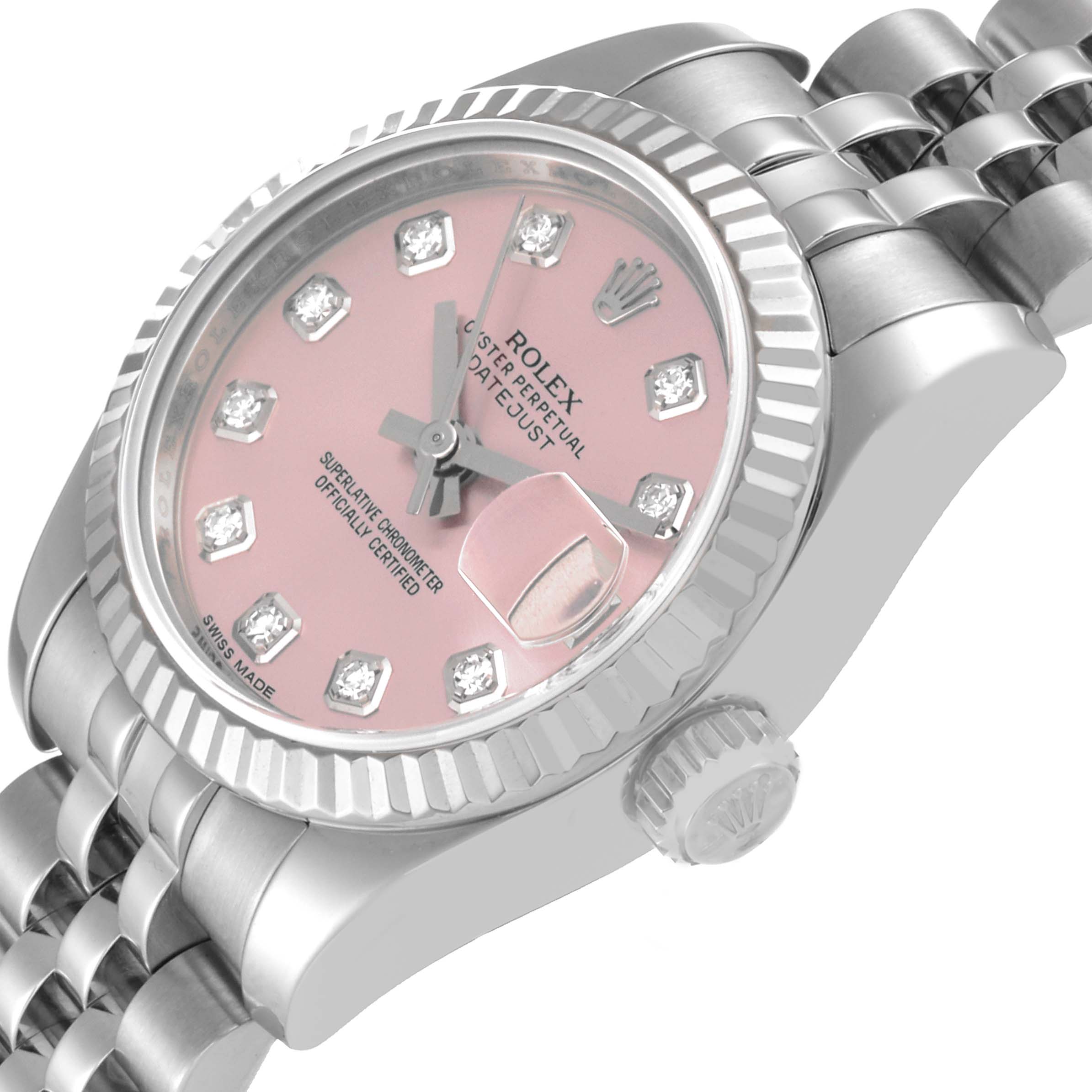 The Rolex Datejust 179174 Women's Stainless Steel Pink Dial 179174 Women's Stainless Steel Pink Dial watch is shown at a slight angle, highlighting its pink dial, diamond markers, crown, and partial bracelet.
