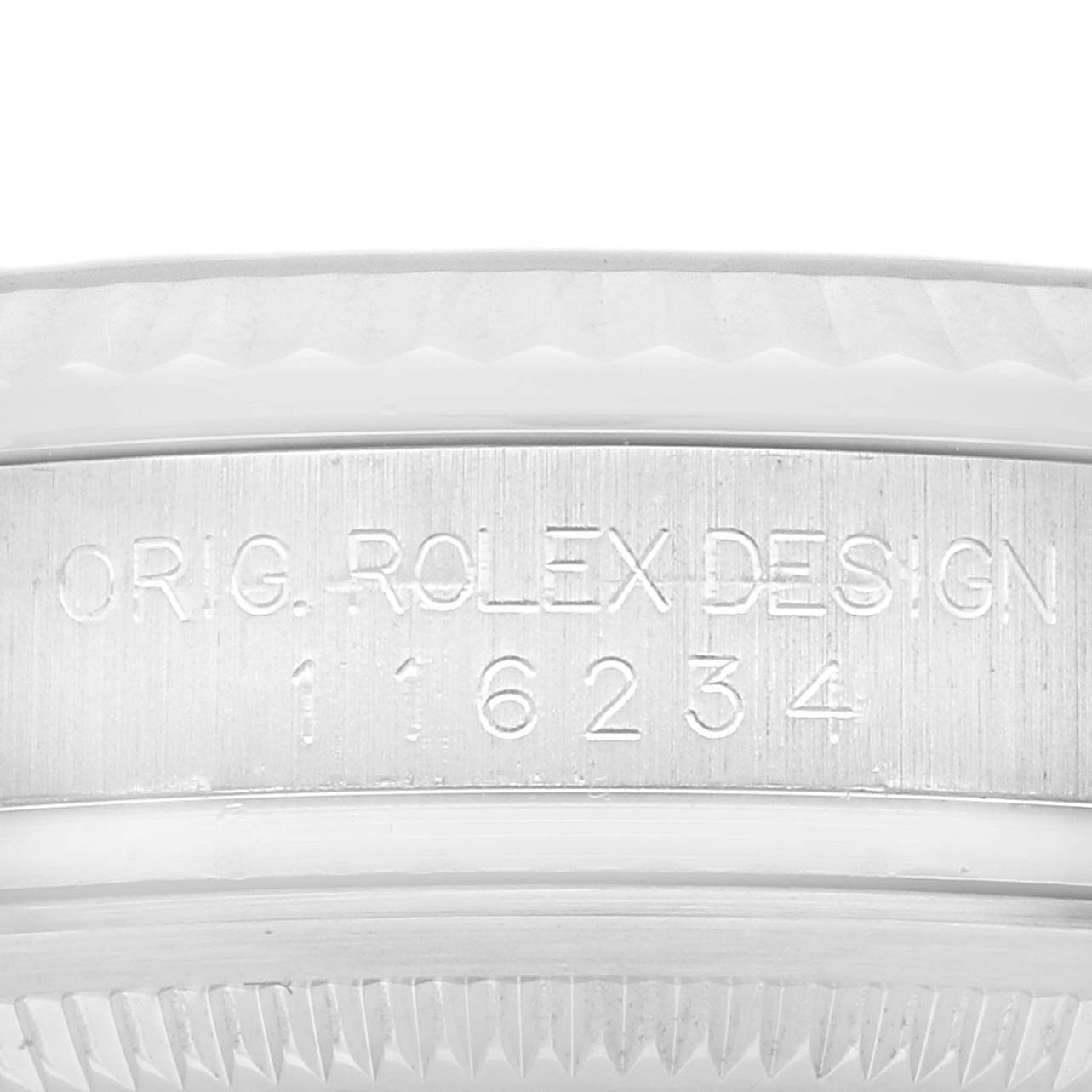 This image shows a close-up view of the case side engraving on a Rolex Datejust 116234 Men's Stainless Steel Silver Dial 116234 Men's Stainless Steel Silver Dial watch.