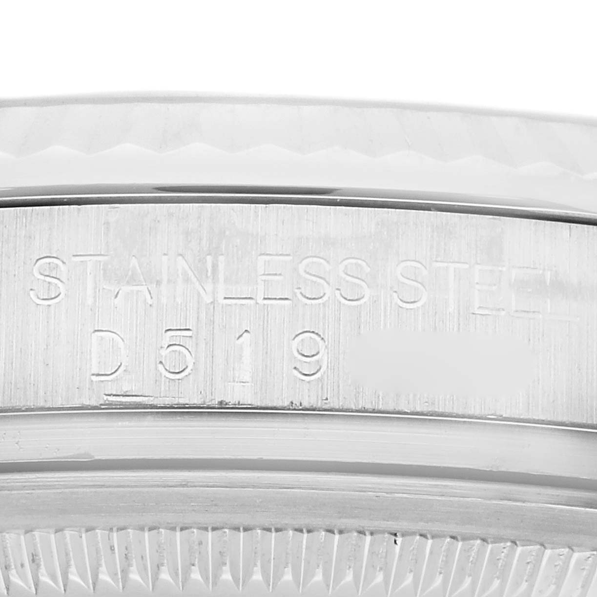 This image shows a close-up view of the side of the Rolex Datejust 116234 Men's Stainless Steel Silver Dial 116234 Men's Stainless Steel Silver Dial watch, highlighting the stainless steel material and a portion of the serial number.