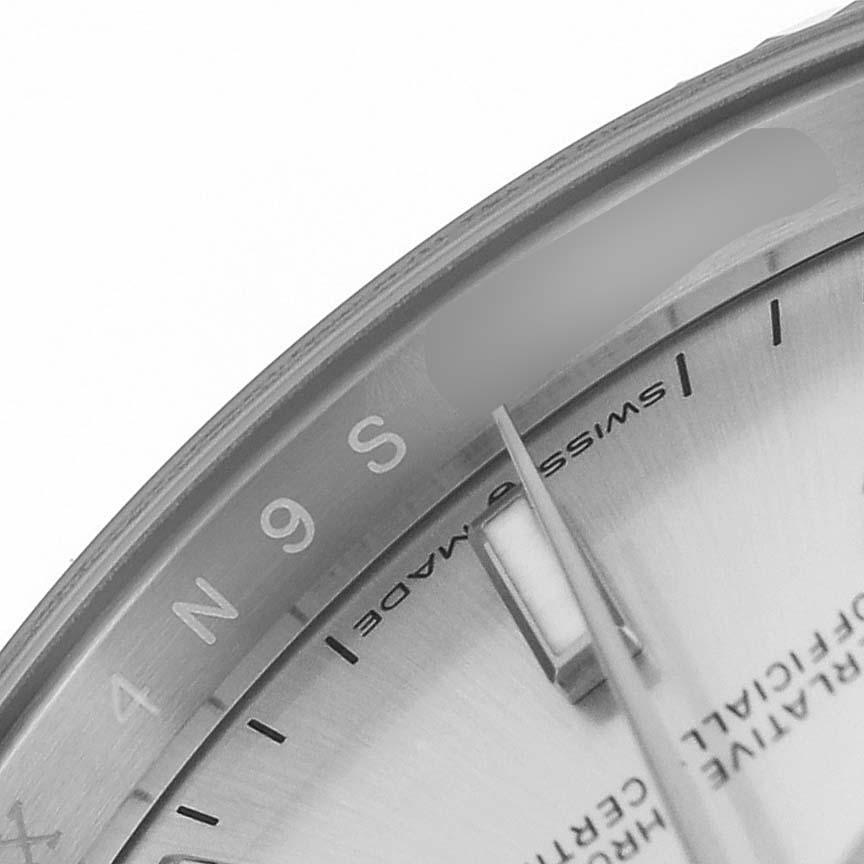 The image shows a partial view of the watch dial and hands of a Rolex Datejust 126234 Men's Stainless Steel Silver Dial, focused on the edge and markers.
