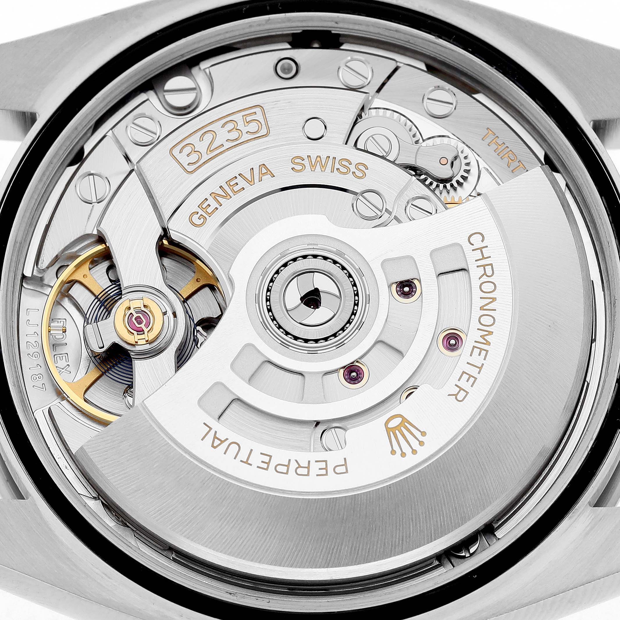The image shows the movement of a Rolex Datejust 126234 Men's Stainless Steel Silver Dial watch from a close-up back angle, highlighting the Perpetual rotor and gear components.