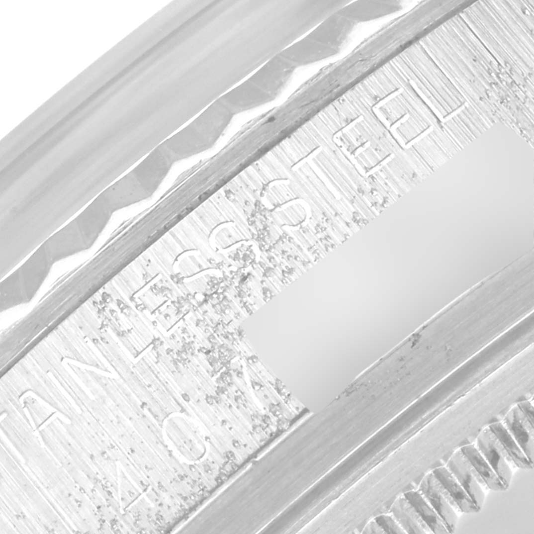 The close-up image shows the stainless steel bezel and part of the flange of a Rolex Datejust 1601 Men's Stainless Steel Silver Dial 1601 Men's Stainless Steel Silver Dial watch.