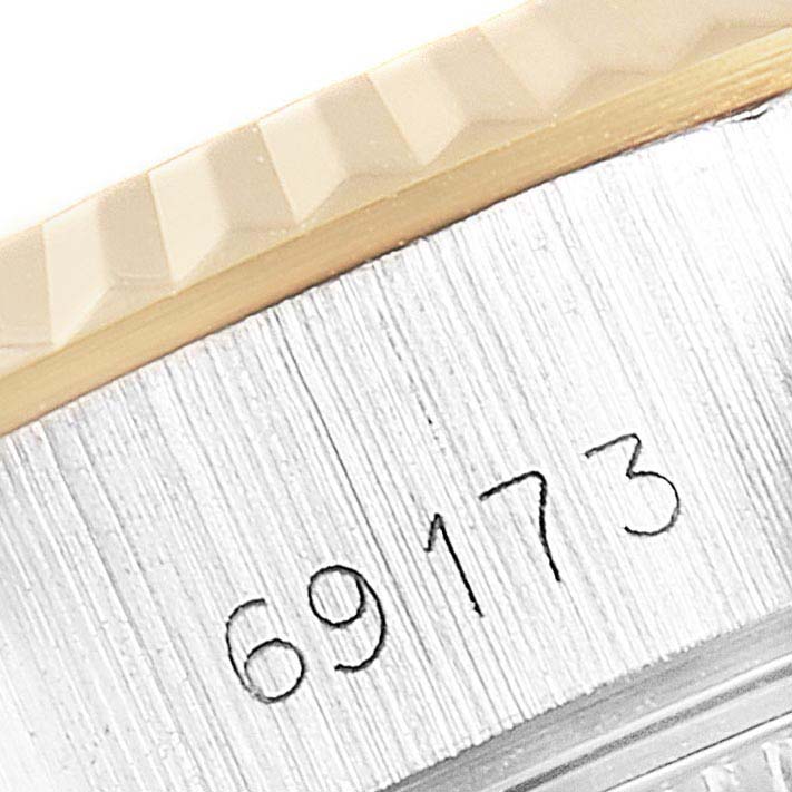 This close-up image shows the model number engraving on the case of a Rolex Datejust 69173 Women
s Steel and Gold (two tone) Black Dial 69173 Women
s Steel and Gold (two tone) Black Dial watch.