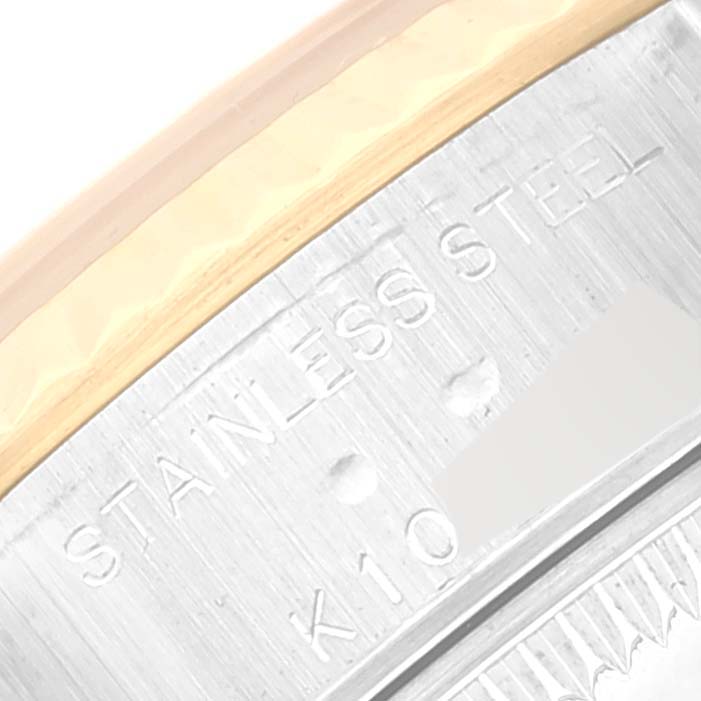 This close-up image shows the engraved text on the case back edge of a Rolex Datejust 79173 Women's Steel and Gold (two tone) Black Dial 79173 Women's Steel and Gold (two tone) Black Dial watch, highlighting the "Stainless Steel" marking.