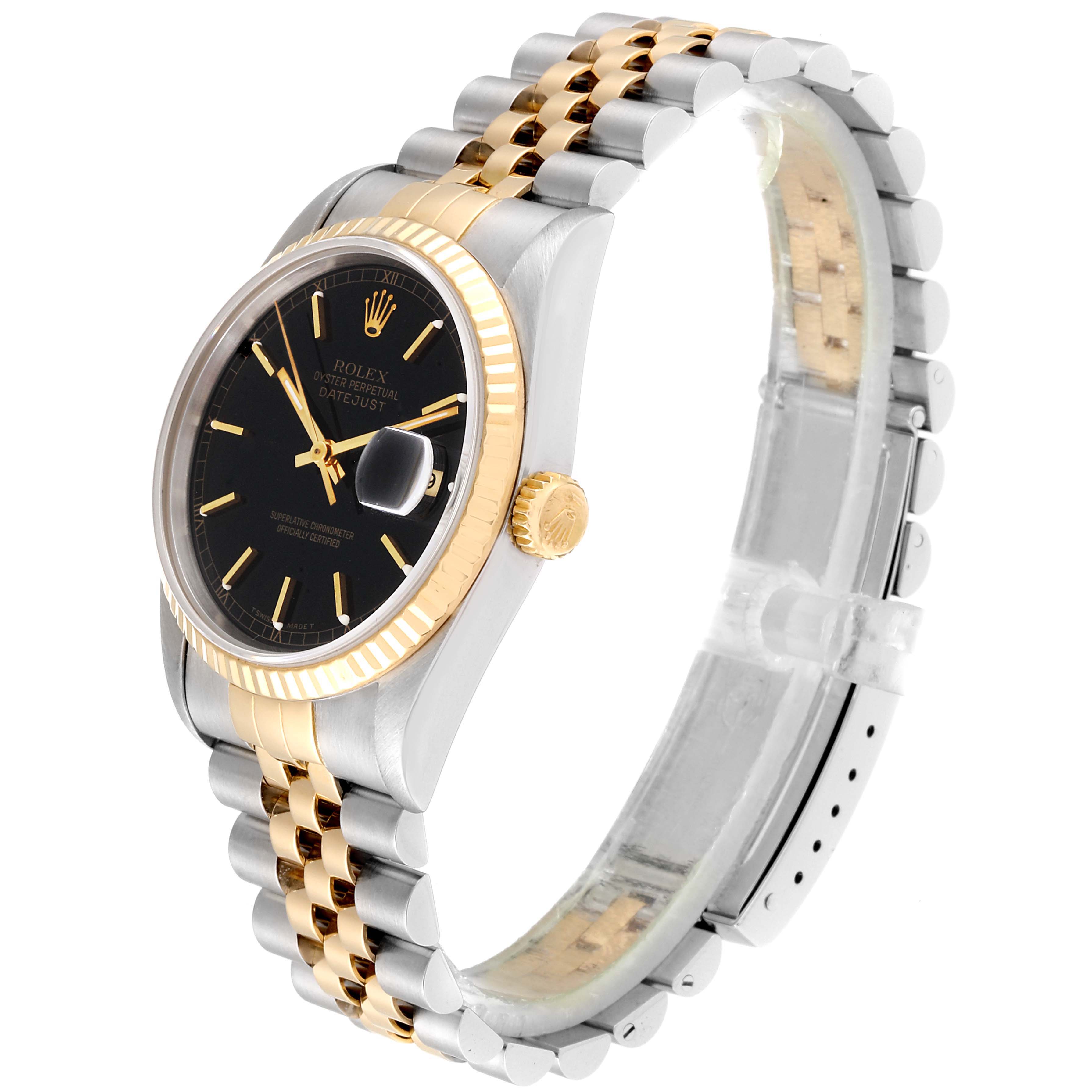 This image shows a Rolex Datejust 16233 Men
s Steel and Gold (two tone) Black Dial 16233 Men
s Steel and Gold (two tone) Black Dial watch from a side angle, highlighting the black dial, fluted bezel, and Jubilee bracelet.