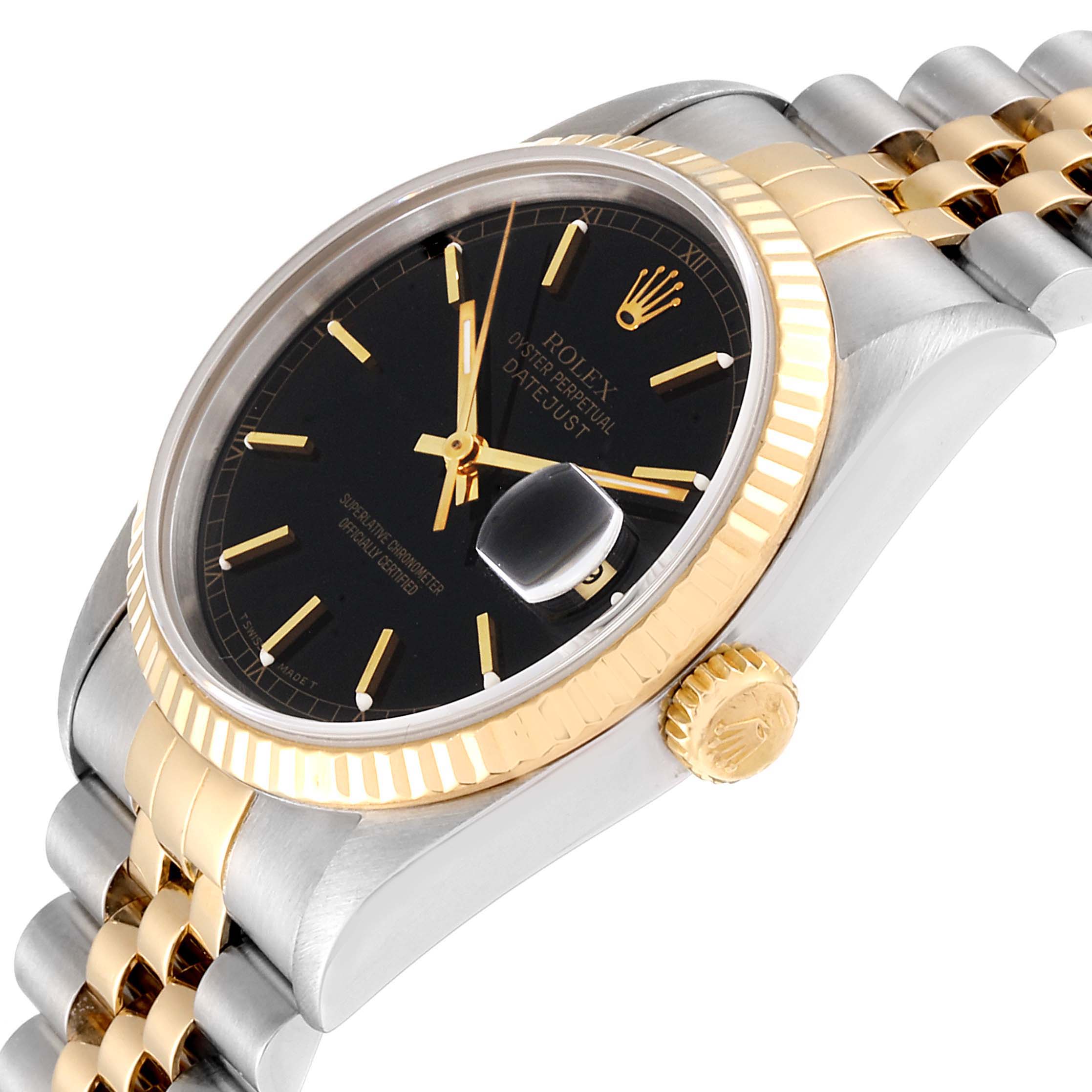 The image shows a side angle of the Rolex Datejust 16233 Men
s Steel and Gold (two tone) Black Dial 16233 Men
s Steel and Gold (two tone) Black Dial watch displaying the black dial, gold bezel, crown, and bi-colored bracelet.