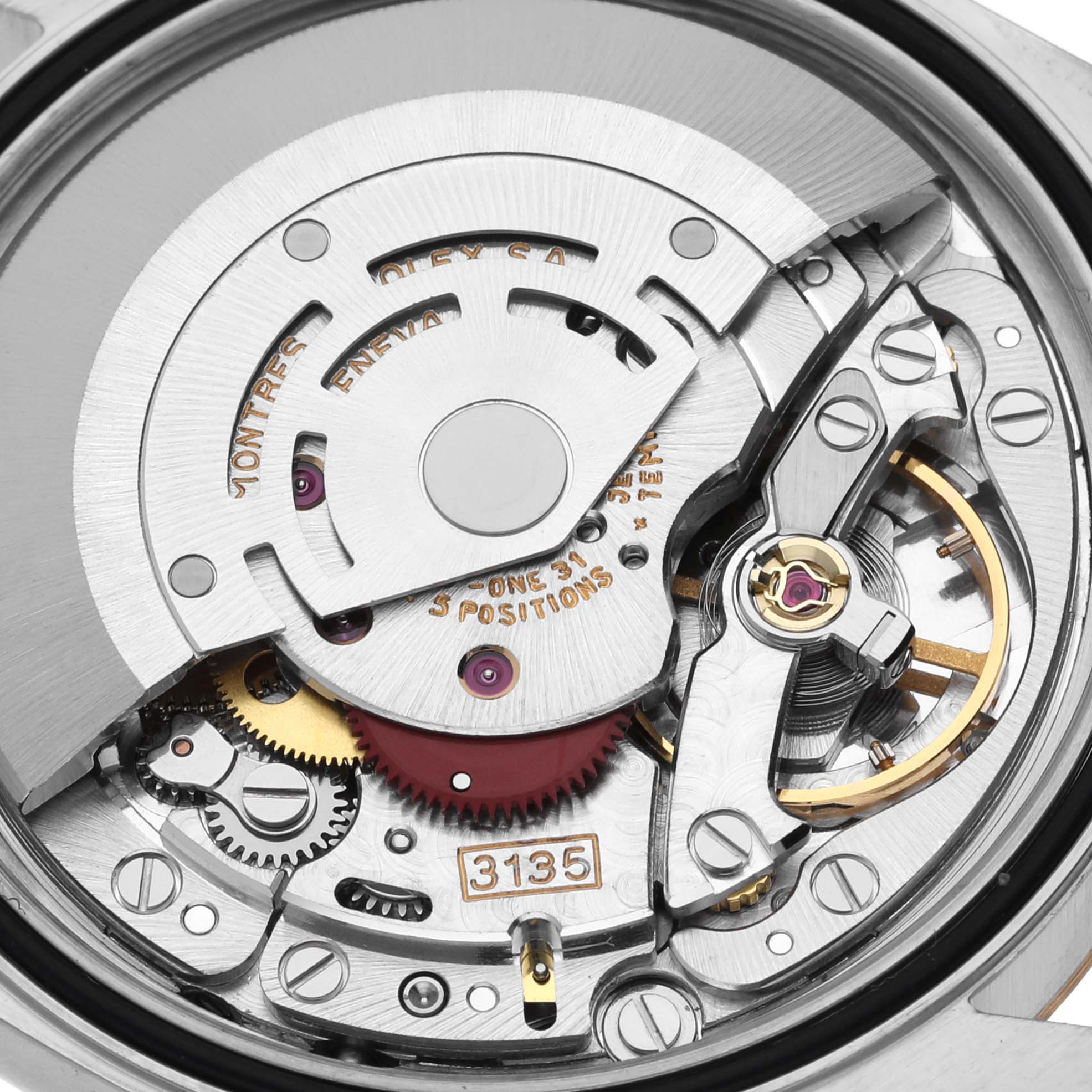 This image shows a close-up view of the internal mechanism of a Rolex Datejust 16233 Men's Steel and Gold (two tone) Champagne Dial 16233 Men's Steel and Gold (two tone) Champagne Dial watch, highlighting the movement and gears.
