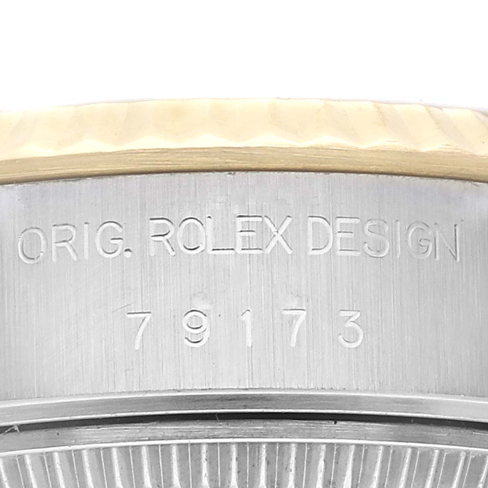 The image shows a close-up of the side engraving of a Rolex Datejust 79173G Women's Steel and Gold (two tone) Champagne Dial 79173G Women's Steel and Gold (two tone) Champagne Dial, highlighting the text "ORIG. ROLEX DESIGN 79173."