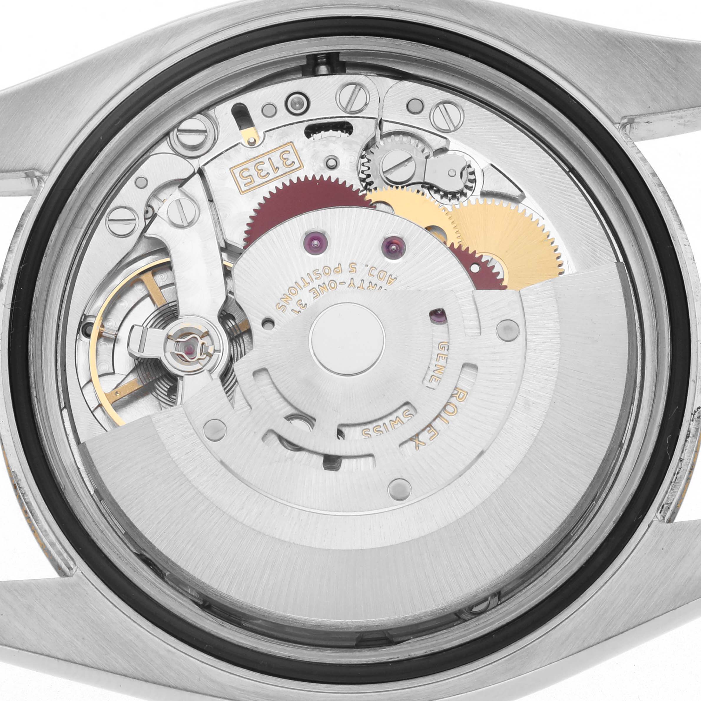 The image shows the back view of a Rolex Datejust 116203 Men
s Steel and Gold (two tone) Champagne Dial 116203 Men
s Steel and Gold (two tone) Champagne Dial watch, highlighting its intricate movement and components.