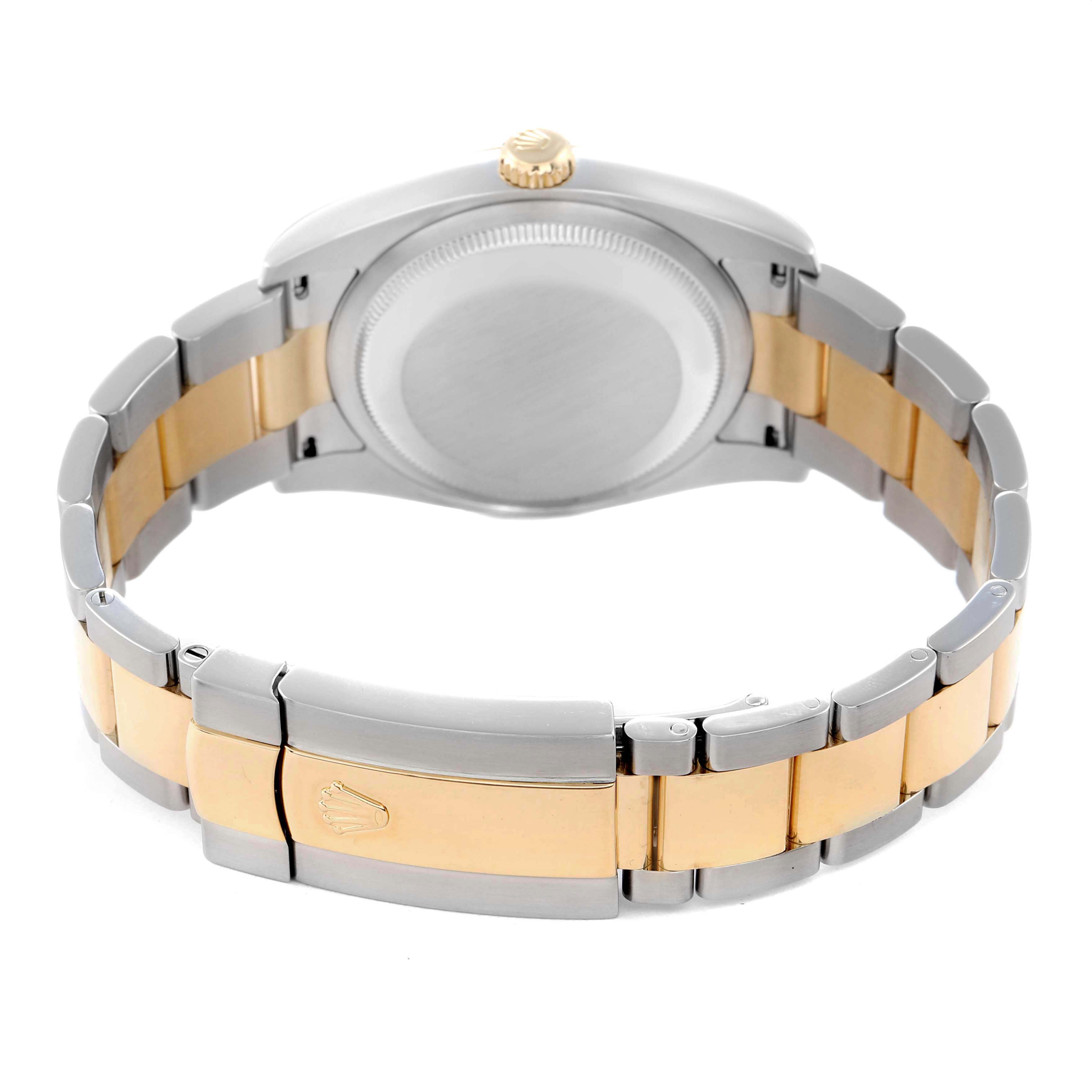 The Rolex Datejust 116203 Men
s Steel and Gold (two tone) Champagne Dial 116203 Men
s Steel and Gold (two tone) Champagne Dial watch is shown from the back, highlighting the case, bracelet, and clasp with a gold and silver color scheme.