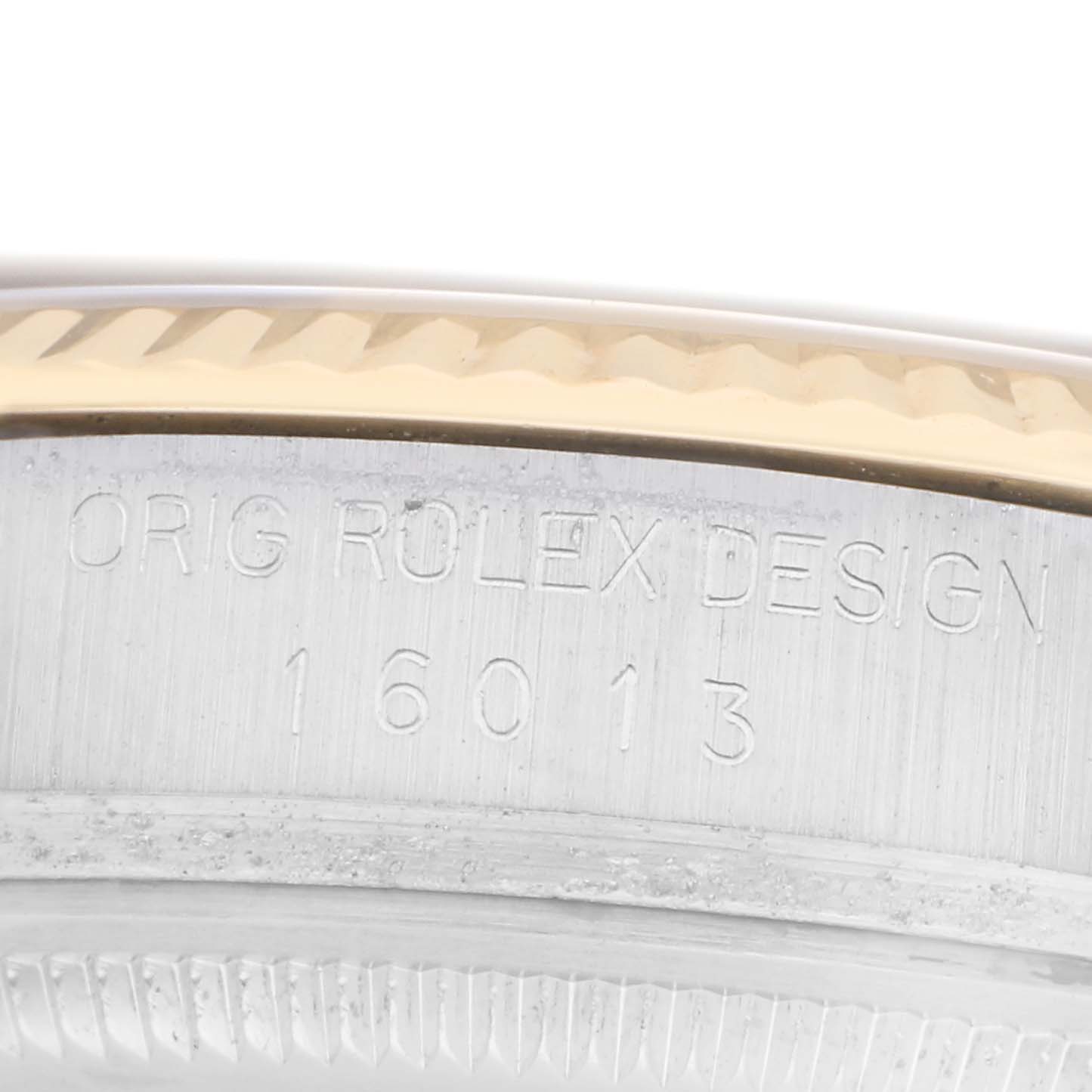 The image shows a close-up of the side, displaying the engraved model number and part of the bezel of the Rolex Vintage Collection 16013 Men
s Steel and Gold (two tone) Champagne Dial 16013 Men
s Steel and Gold (two tone) Champagne Dial.