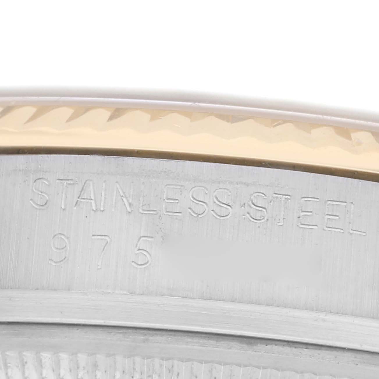 The image shows a close-up of the side of a Rolex Vintage Collection 16013 Men
s Steel and Gold (two tone) Champagne Dial 16013 Men
s Steel and Gold (two tone) Champagne Dial model watch, highlighting the stainless steel engraving.