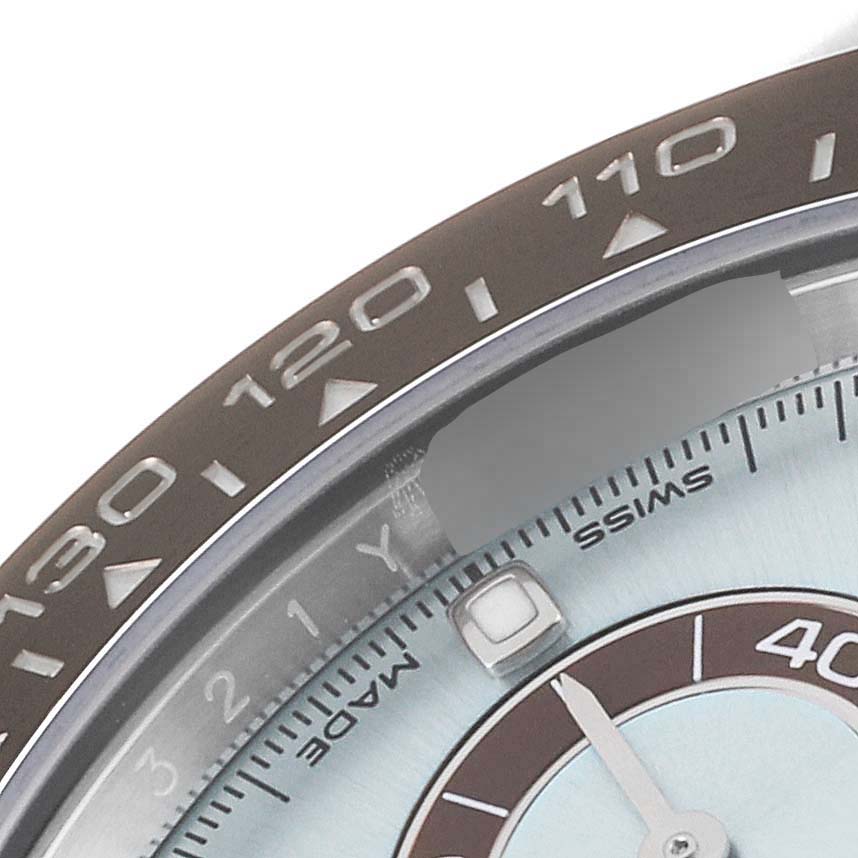 This close-up image shows the bezel, part of the dial, and one hand of the Rolex Daytona 116506 Men's Platinum Blue Dial 116506 Men's Platinum Blue Dial watch.