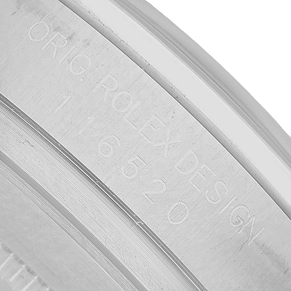 The image shows the engraved case back edge of a Rolex Daytona 116520 Men's Stainless Steel White Dial, highlighting the model number.