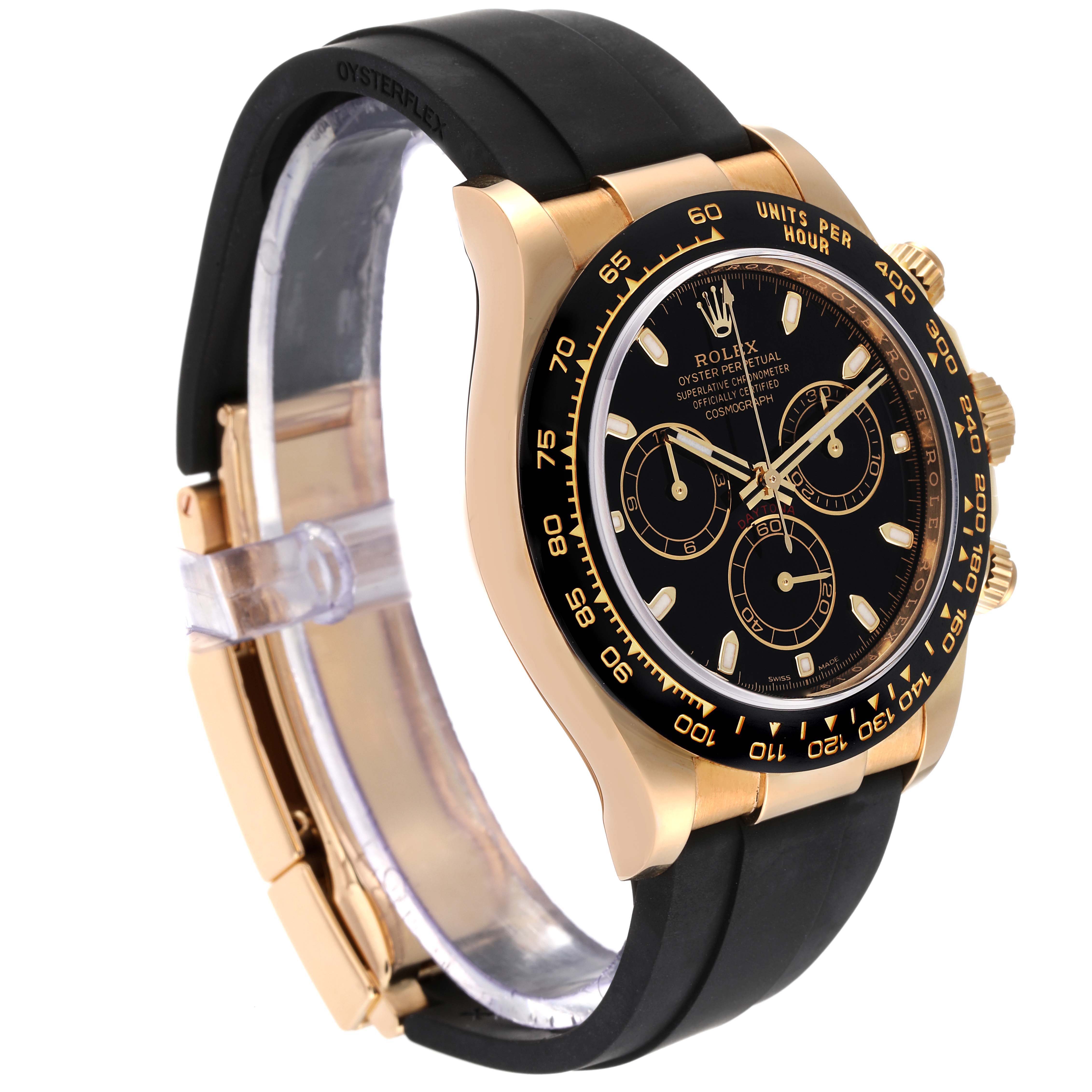 The image shows a side view of a Rolex Daytona 116518 Men's Yellow Gold Black Dial 116518 Men's Yellow Gold Black Dial model watch with a black rubber strap and a gold case bezel.