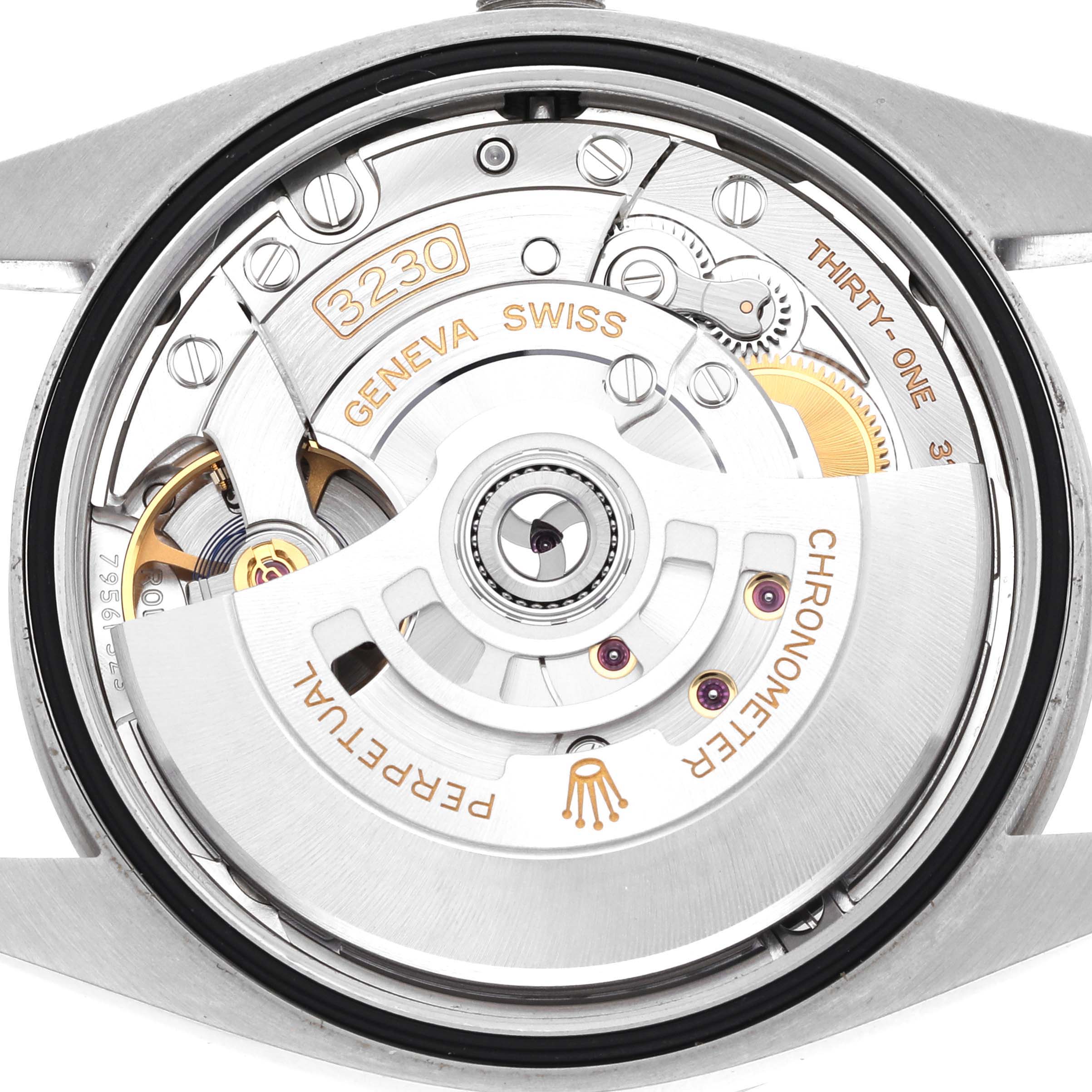 The image shows the back view of the Rolex Explorer 124270 Men
s Stainless Steel Black Dial 124270 Men
s Stainless Steel Black Dial, highlighting its intricate movement and rotor assembly.