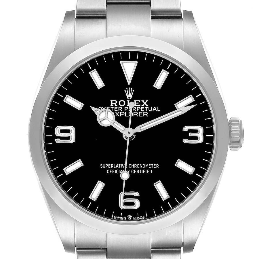 The Rolex Explorer watch is shown from a top-down angle, displaying the dial, bezel, crown, and part of the bracelet.