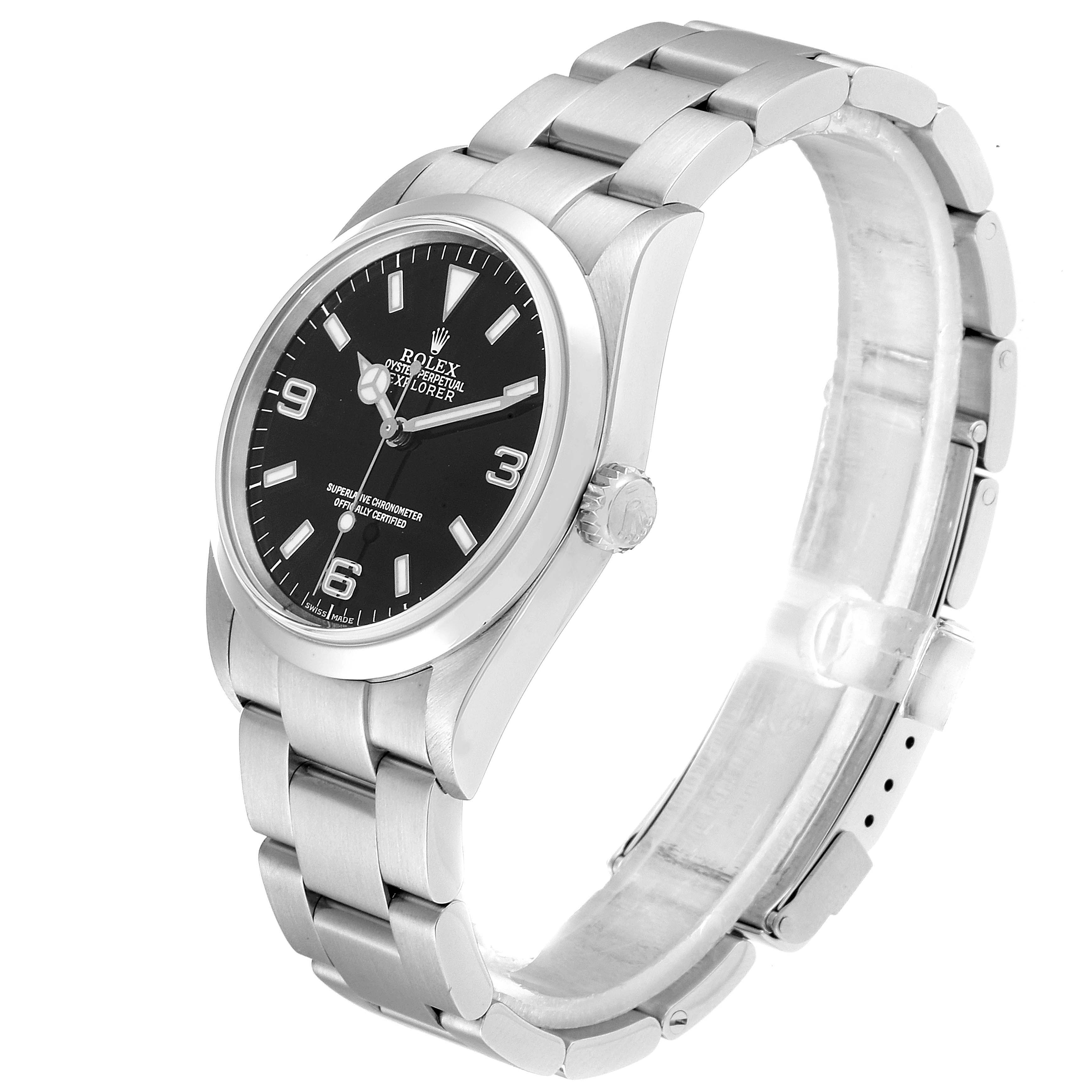 The image shows a side angle view of a Rolex Explorer 114270 Men
s Stainless Steel Black Dial 114270 Men
s Stainless Steel Black Dial watch, highlighting its face, crown, and bracelet.