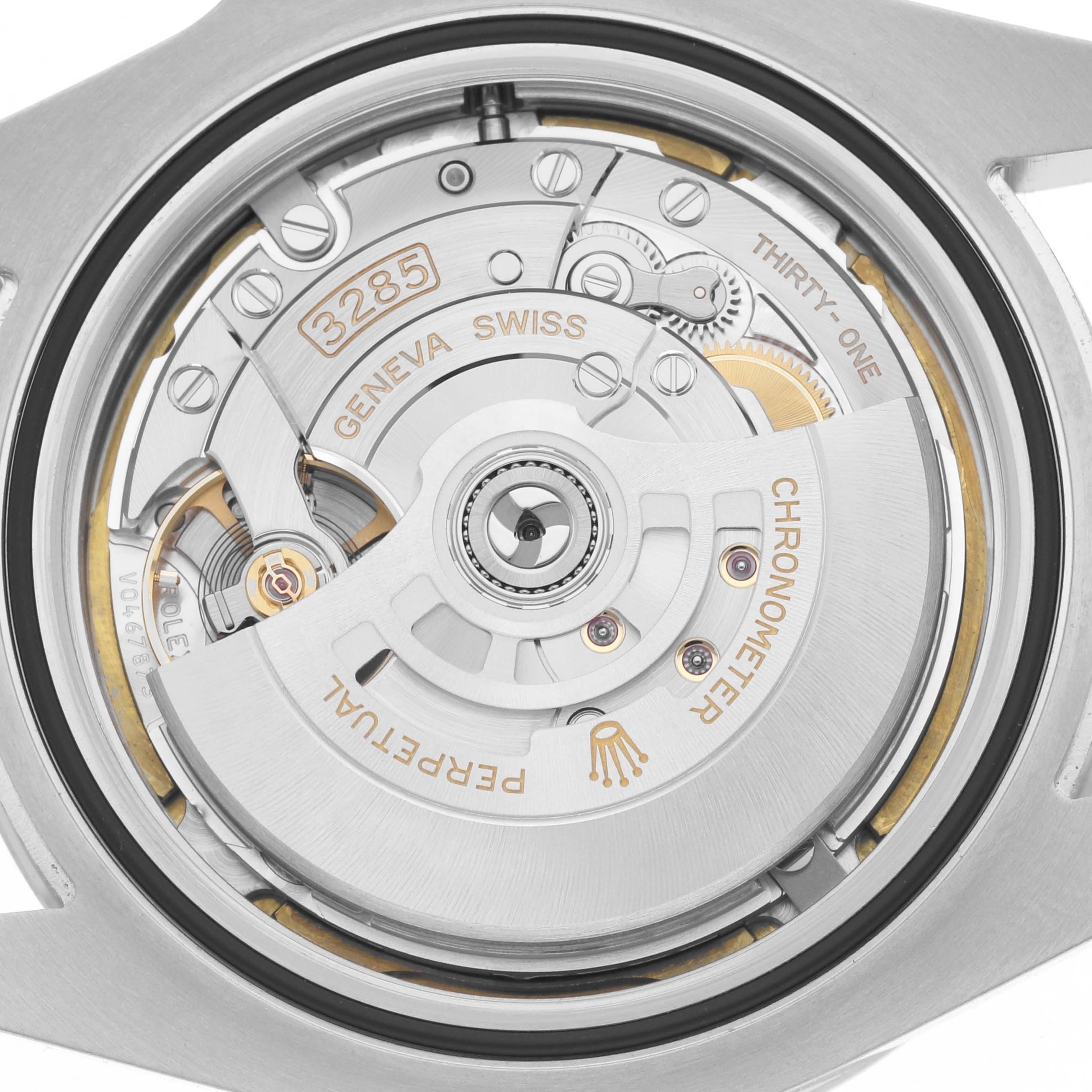 The image shows the movement and rotor of a Rolex Explorer 226570 Men
s Stainless Steel Black Dial 226570 Men
s Stainless Steel Black Dial watch from a rear angle, highlighting the intricate mechanics.