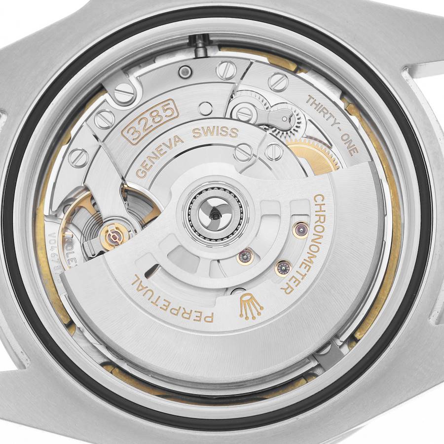 The image shows the movement and rotor of a Rolex Explorer 226570 Men's Stainless Steel Black Dial 226570 Men's Stainless Steel Black Dial watch from a rear angle, highlighting the intricate mechanics.