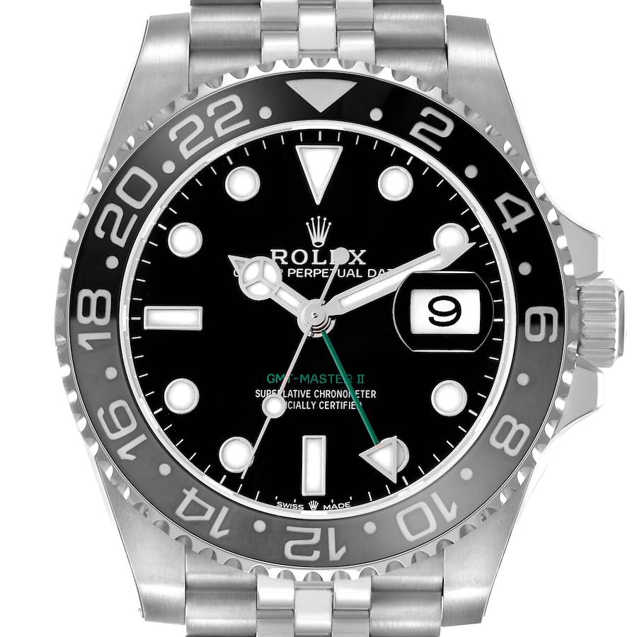 The Rolex GMT-Master watch is shown from a front angle, displaying the bezel, dial, hands, and part of the bracelet.