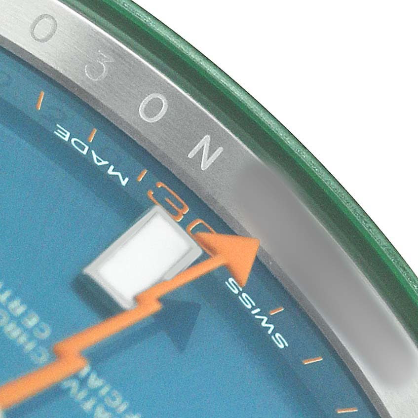 The image shows a close-up of the Rolex Milgauss M116400GV Men's Stainless Steel Blue Dial watch face with part of the dial, including the orange lightning bolt second hand.