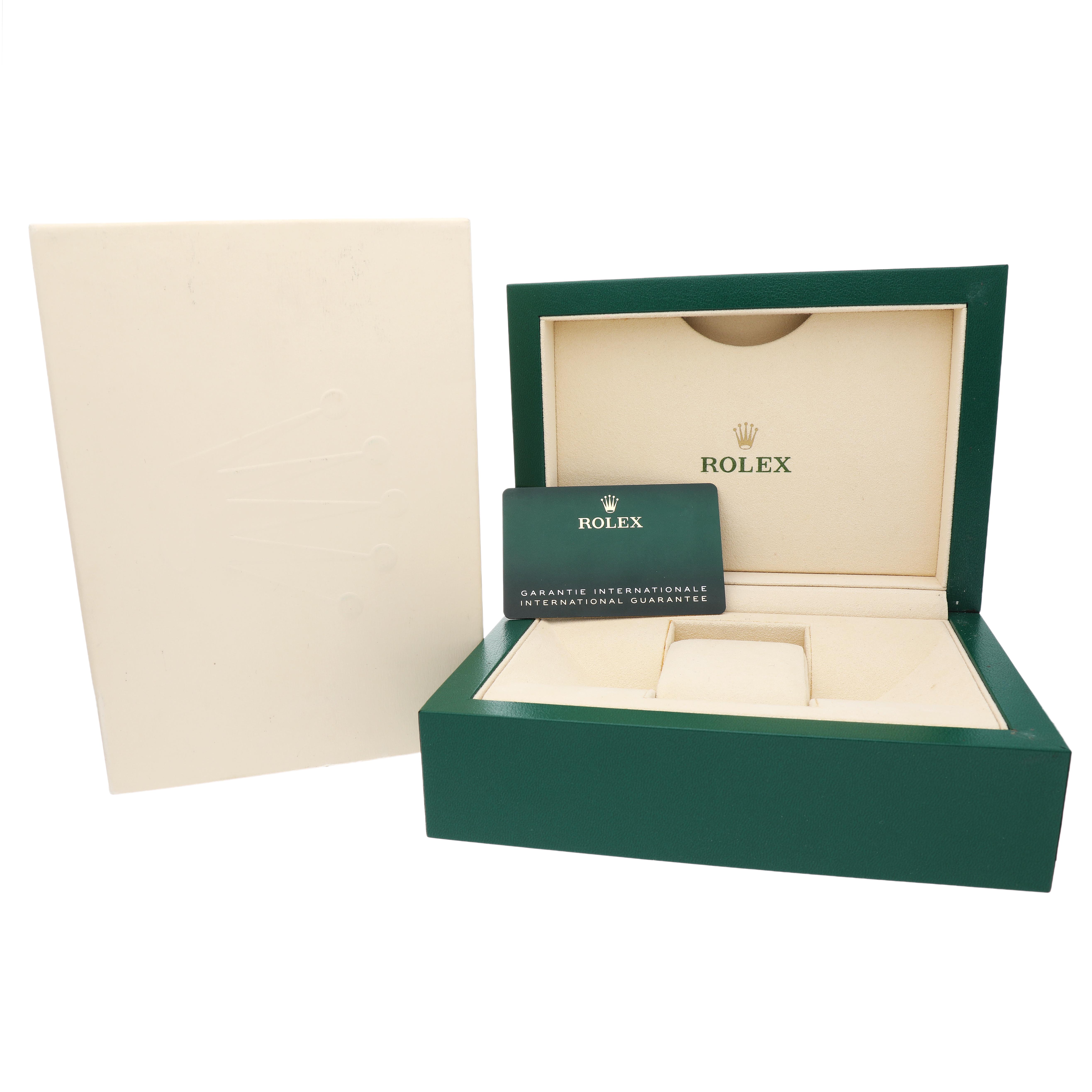 The image shows the packaging for a Rolex Milgauss M116400GV Men's Stainless Steel Blue Dial, featuring an open green box, a guarantee card, and an outer box.