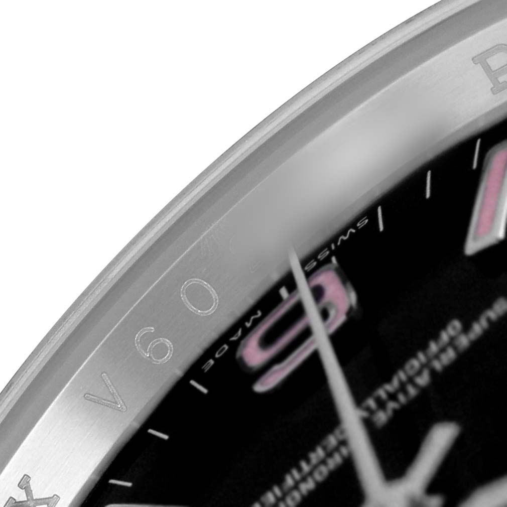 The image shows a close-up of the dial and bezel edge of a Rolex Oyster Perpetual 116000 Men's Stainless Steel Black Dial watch, highlighting the engraved details.