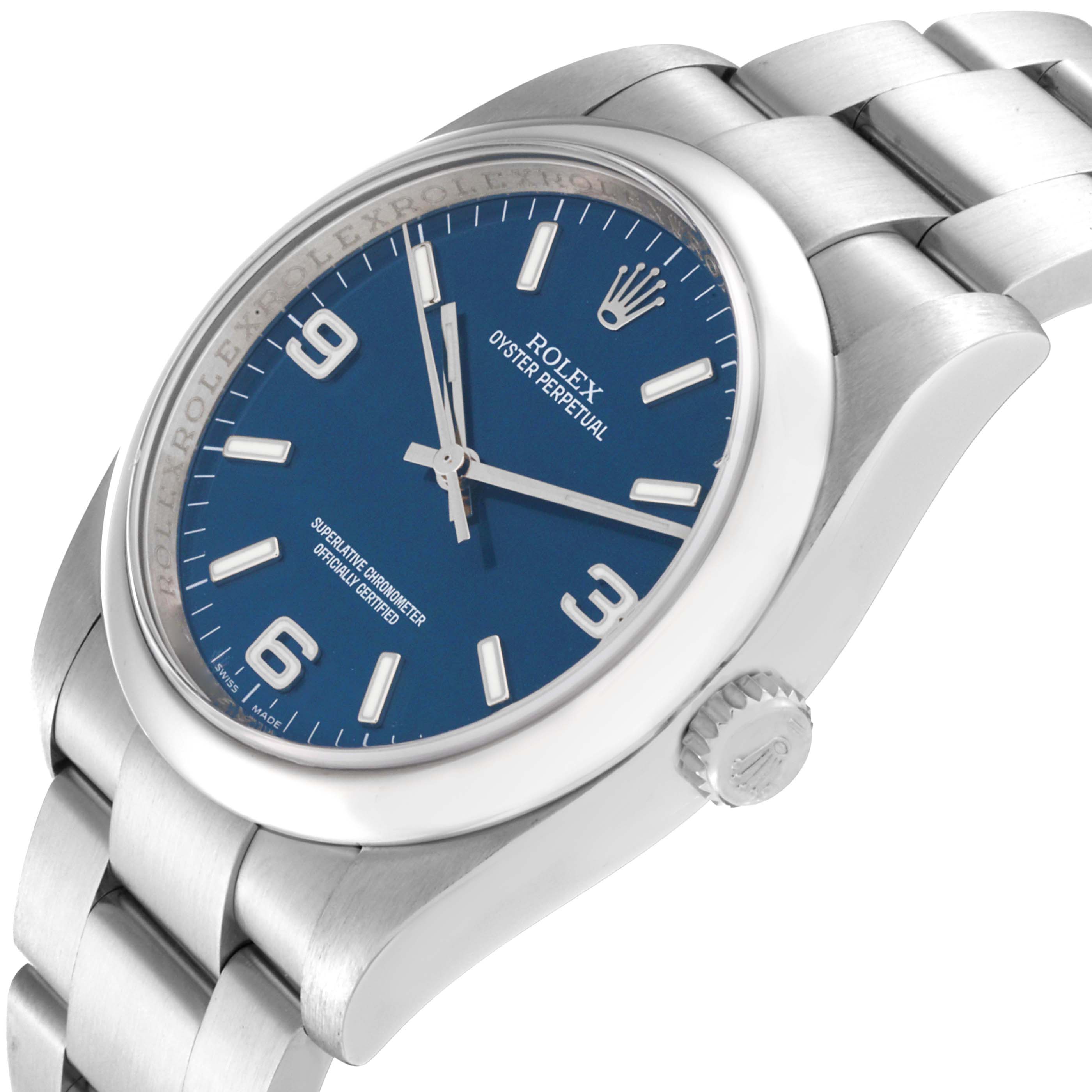 The image shows a side-angle view of a Rolex Oyster Perpetual 116000 Men's Stainless Steel Blue Dial 116000 Men's Stainless Steel Blue Dial watch, displaying the face, crown, and part of the bracelet.