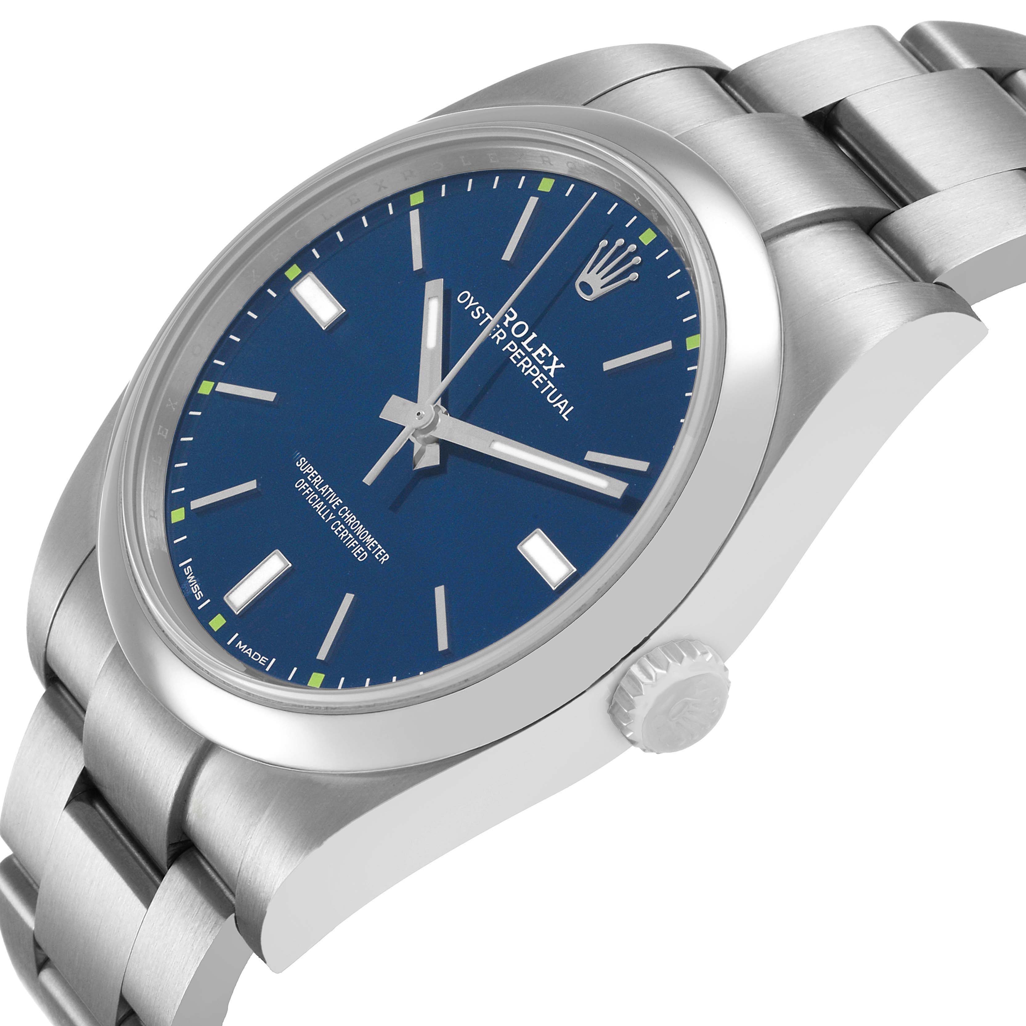 The Rolex Oyster Perpetual 114300 Men's Stainless Steel Blue Dial watch is shown at a three-quarter angle, highlighting the blue dial, crown, and stainless steel bracelet.