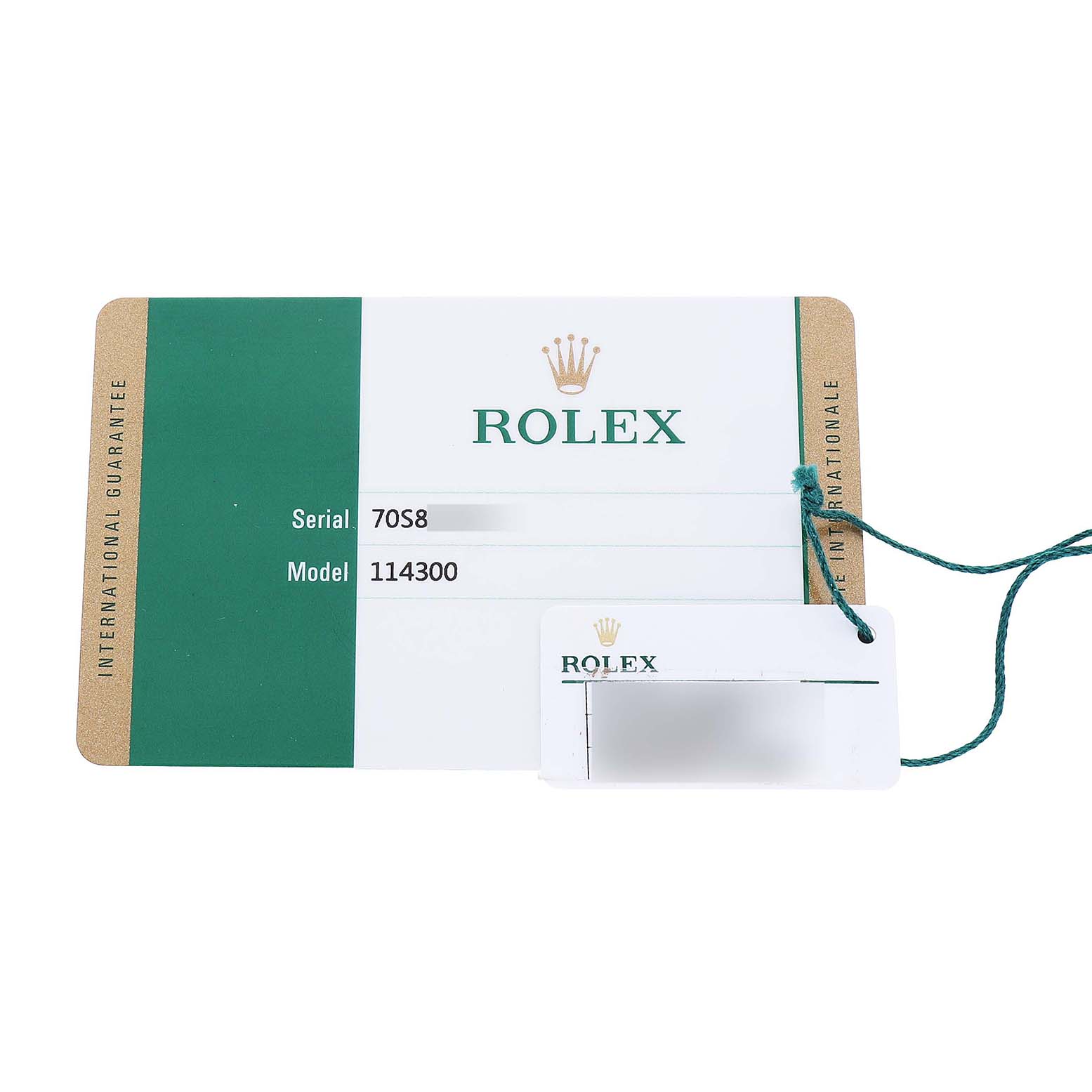 The image shows an International Guarantee card and tag for a Rolex Oyster Perpetual 114300 Men's Stainless Steel Blue Dial model 114300.
