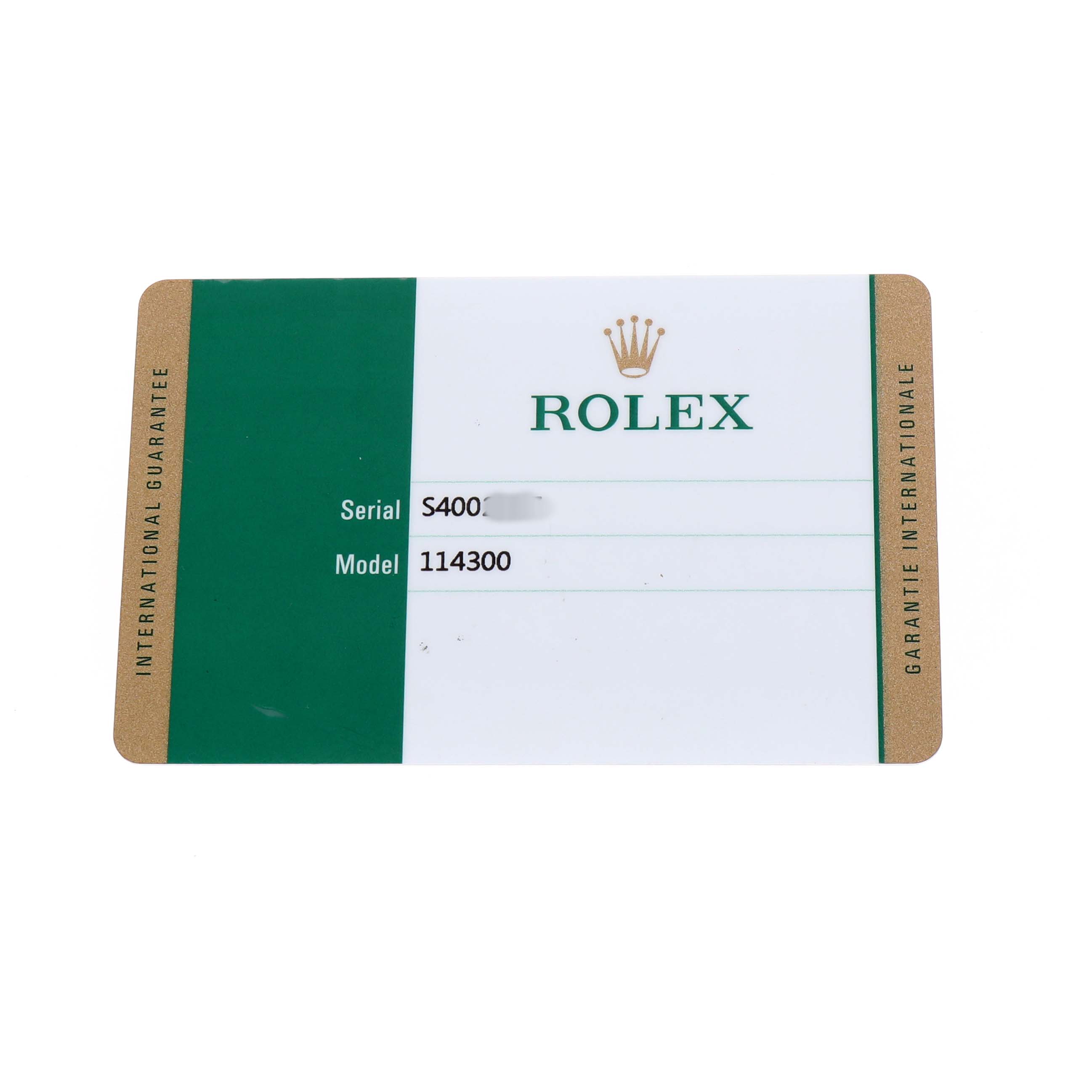 The image shows an international guarantee card for the Rolex Oyster Perpetual 114300 Men's Stainless Steel Blue Dial, displaying model and serial numbers.