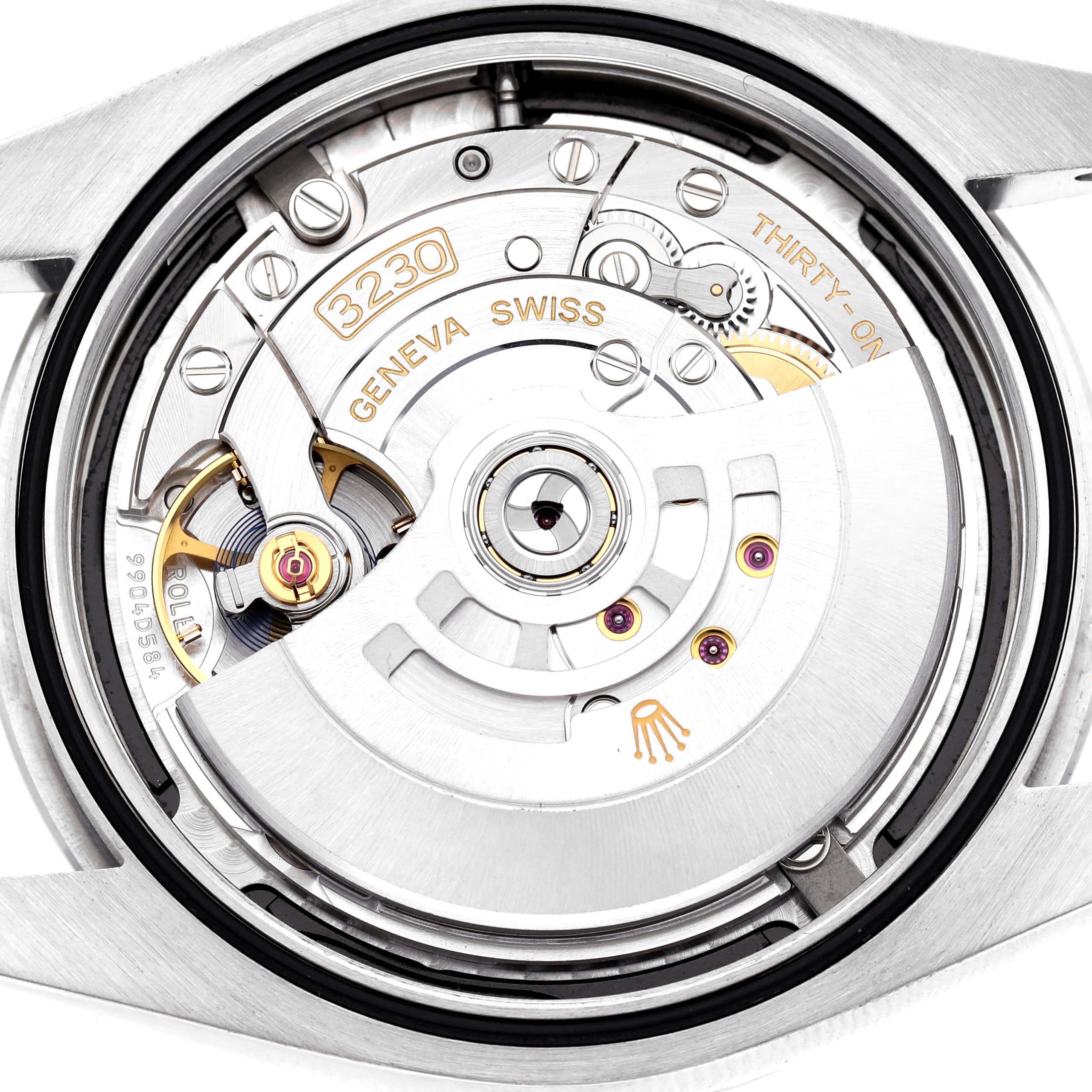 The image shows the back of a Rolex Oyster Perpetual M124300-0002 Men's Stainless Steel Black Dial watch, highlighting its movement mechanism.