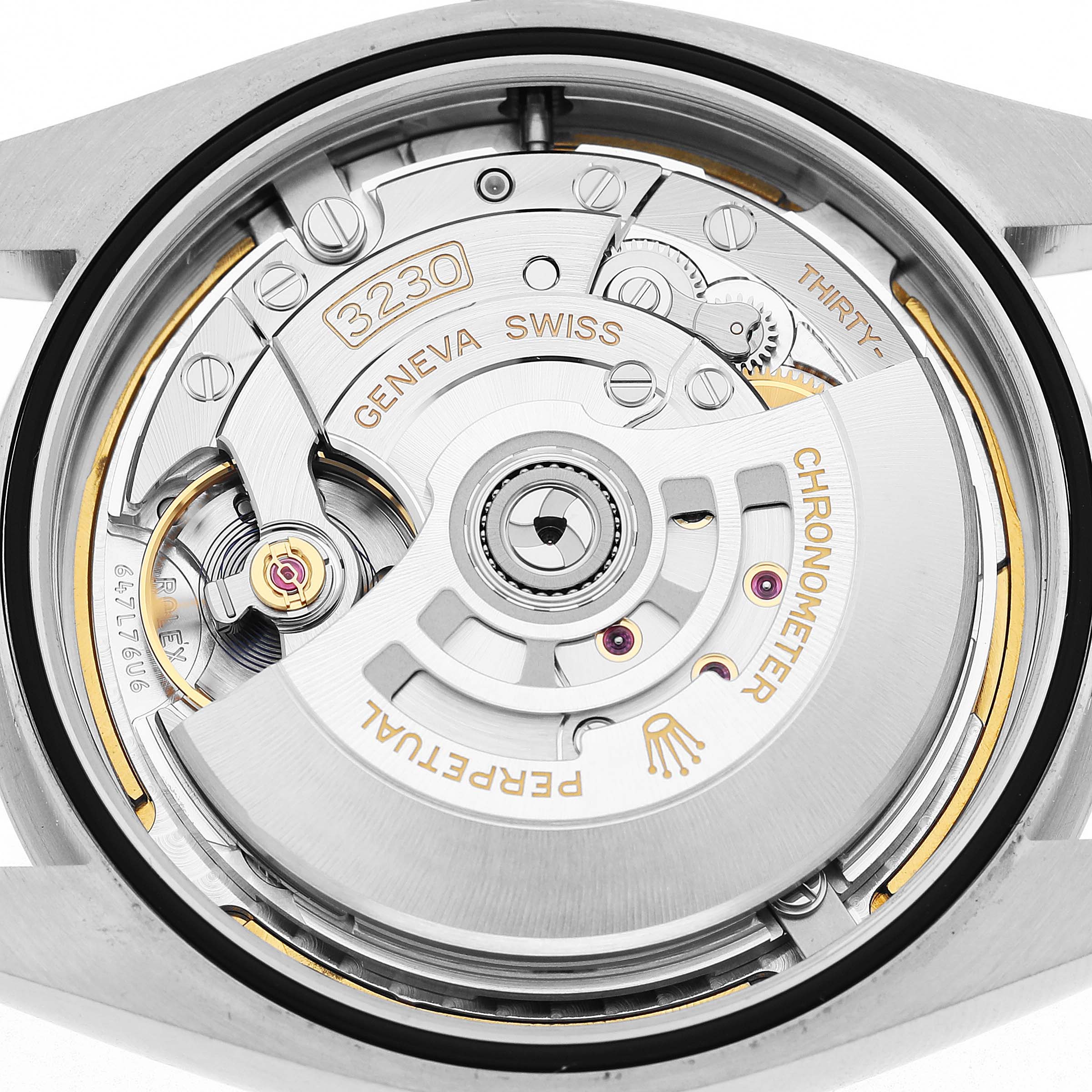 The image shows the movement of a Rolex Oyster Perpetual 134300 Men's Stainless Steel Green Dial, focusing on the rotor and inner mechanics from a rear angle.