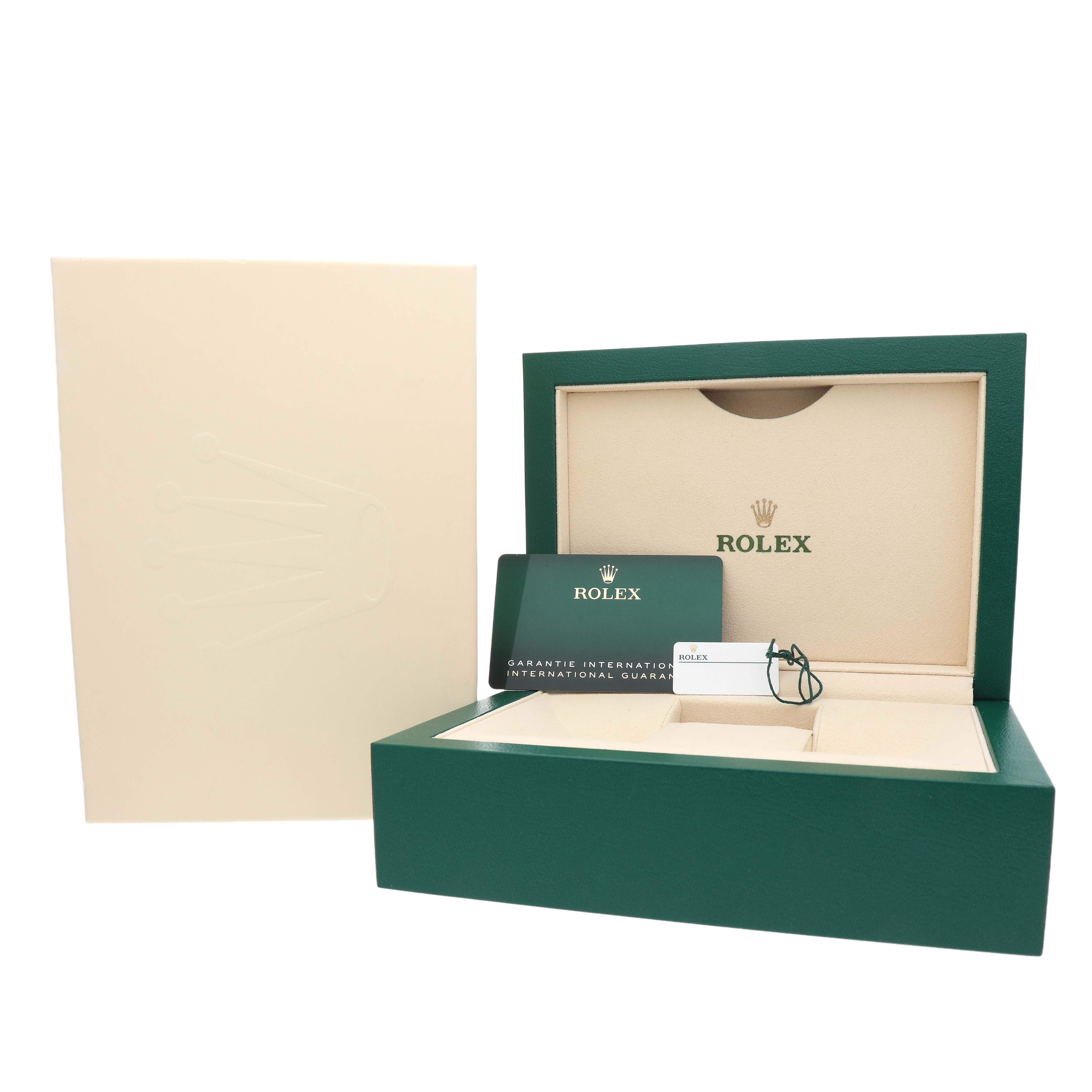 The image shows the packaging for a Rolex Oyster Perpetual 134300 Men's Stainless Steel Green Dial, including the open box, a warranty card, and tags.