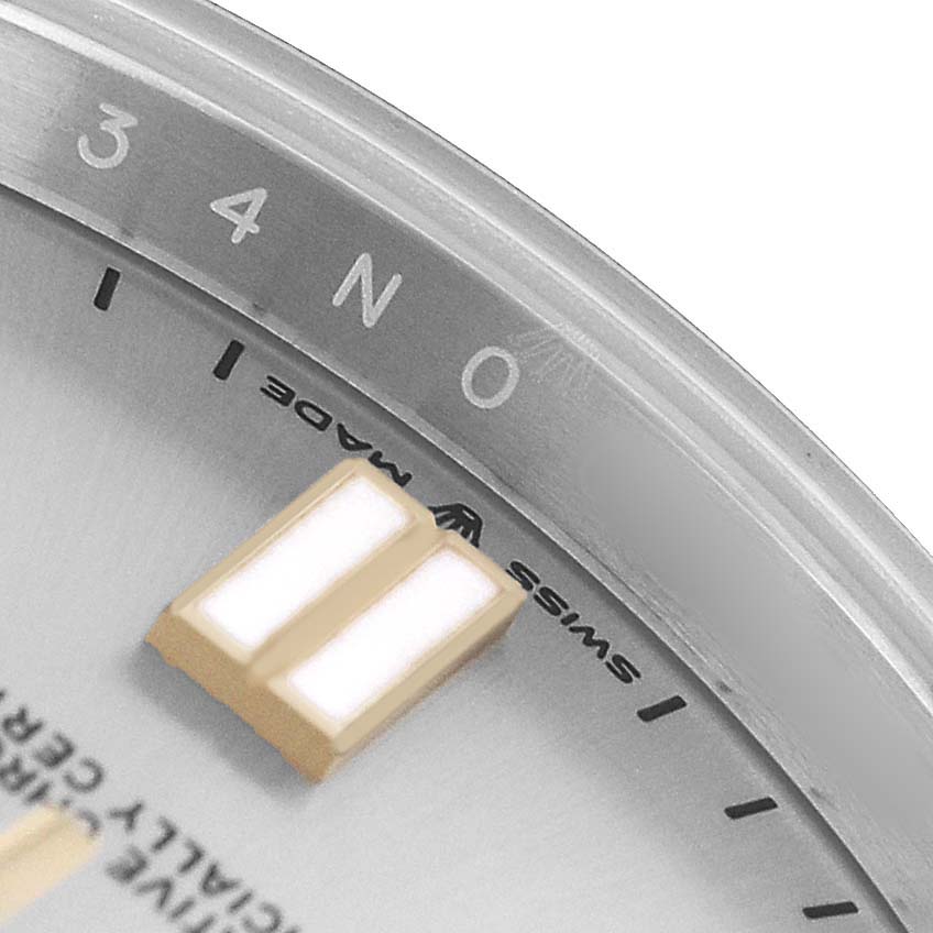 The image shows a close-up of the Rolex Oyster Perpetual 124300 Men's Stainless Steel Silver Dial watch face, focusing on the dial and the "Swiss Made" text.