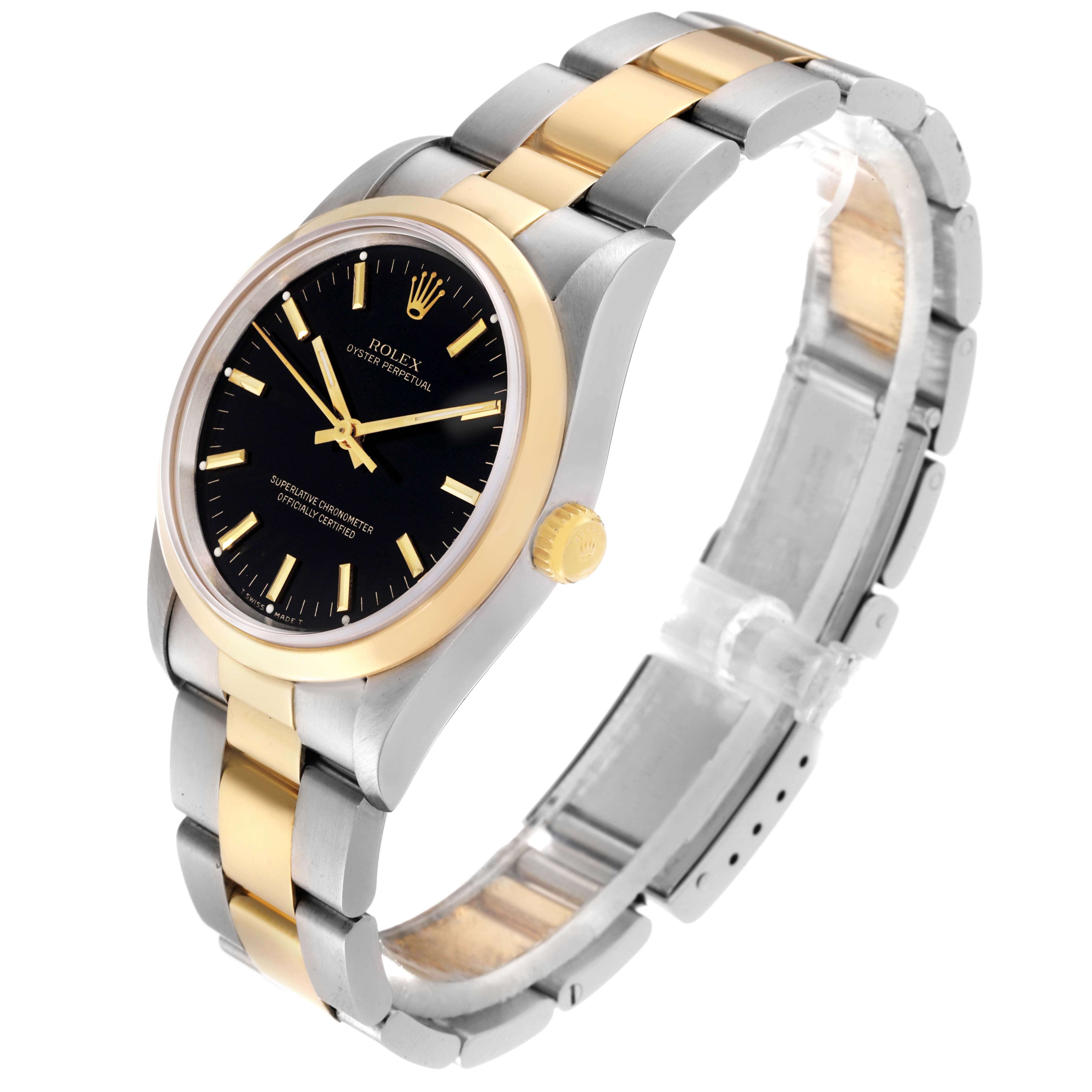 The Rolex Oyster Perpetual 14203 Men's Steel and Gold (two tone) Black Dial 14203 Men's Steel and Gold (two tone) Black Dial watch is shown from an angled side view, highlighting the dial, bezel, crown, and bracelet.