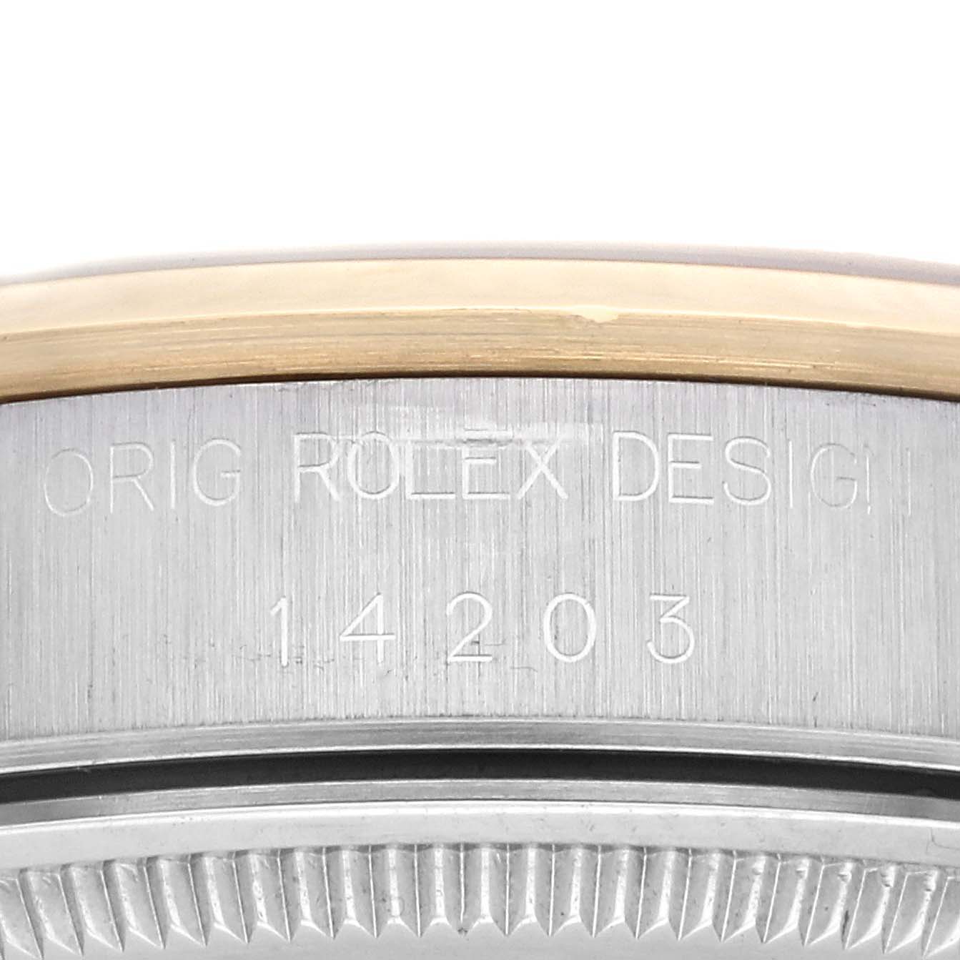 This is a close-up image of the case back and bezel of a Rolex Oyster Perpetual 14203 Men's Steel and Gold (two tone) Black Dial 14203 Men's Steel and Gold (two tone) Black Dial, showing the engraved model number 14203.