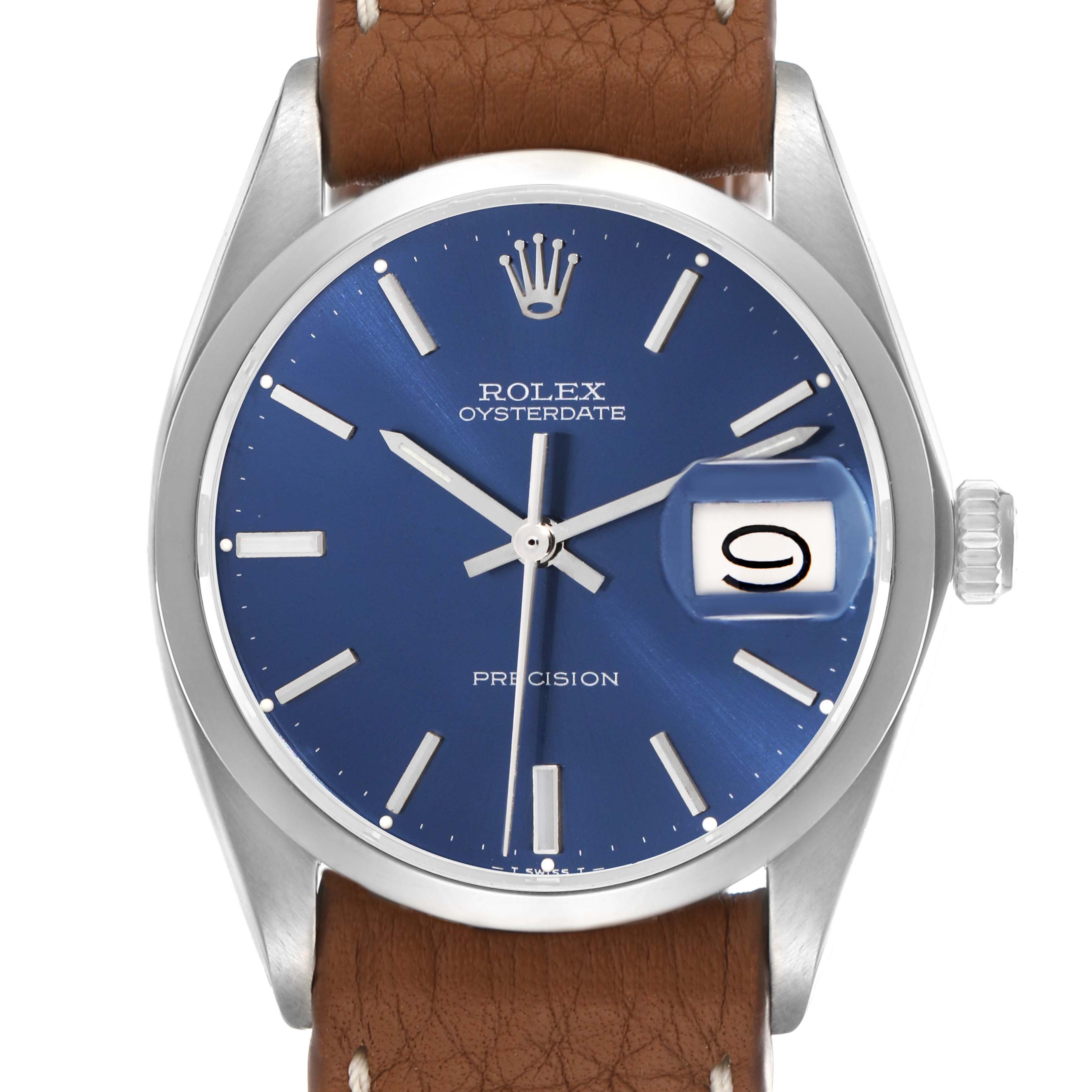The vintage Rolex Oysterdate watch is shown from a front angle, highlighting the blue dial, silver markers, and date window.